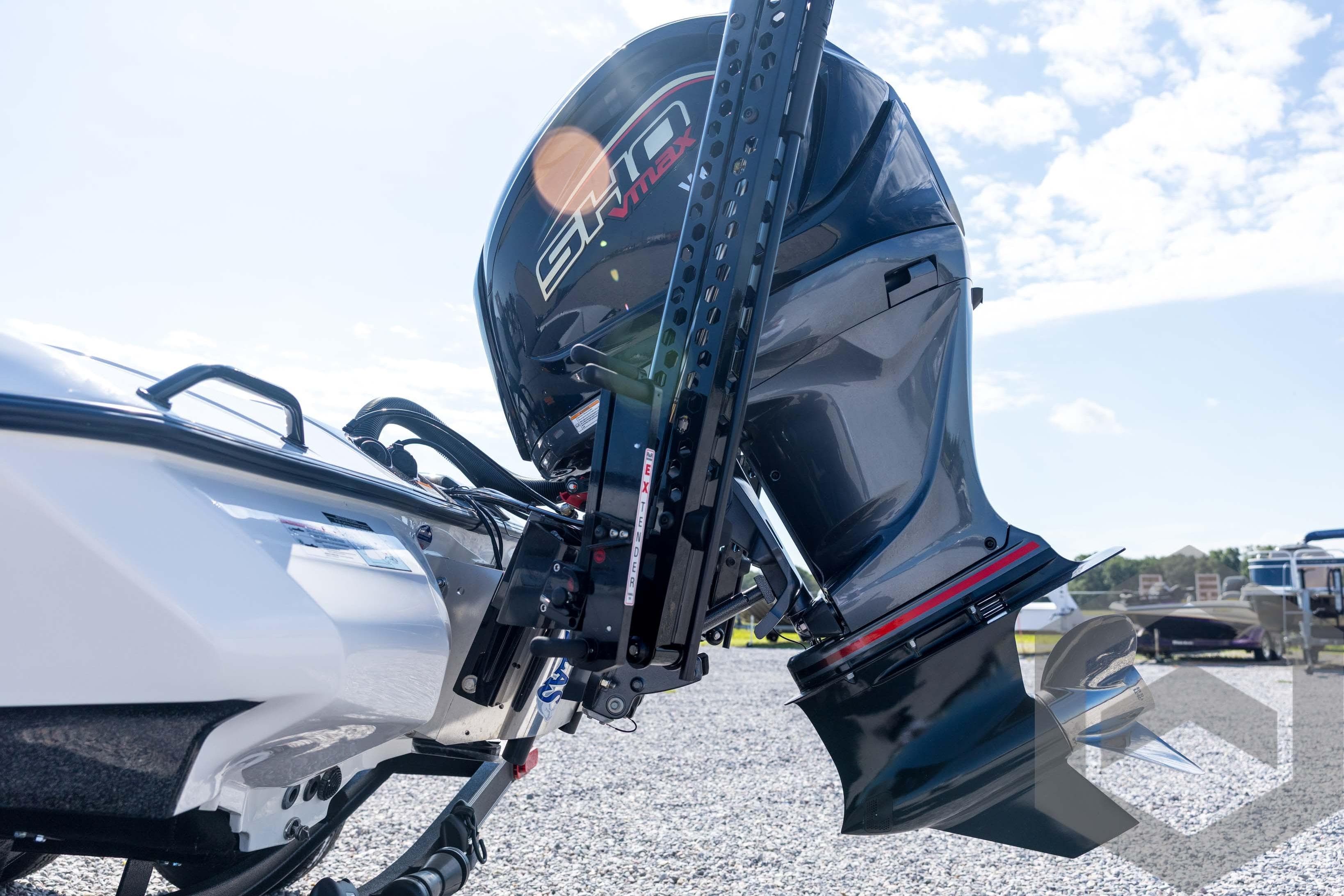 2026 Skeeter ZXE21 boat engine, close-up view, outdoors on a sunny day.
