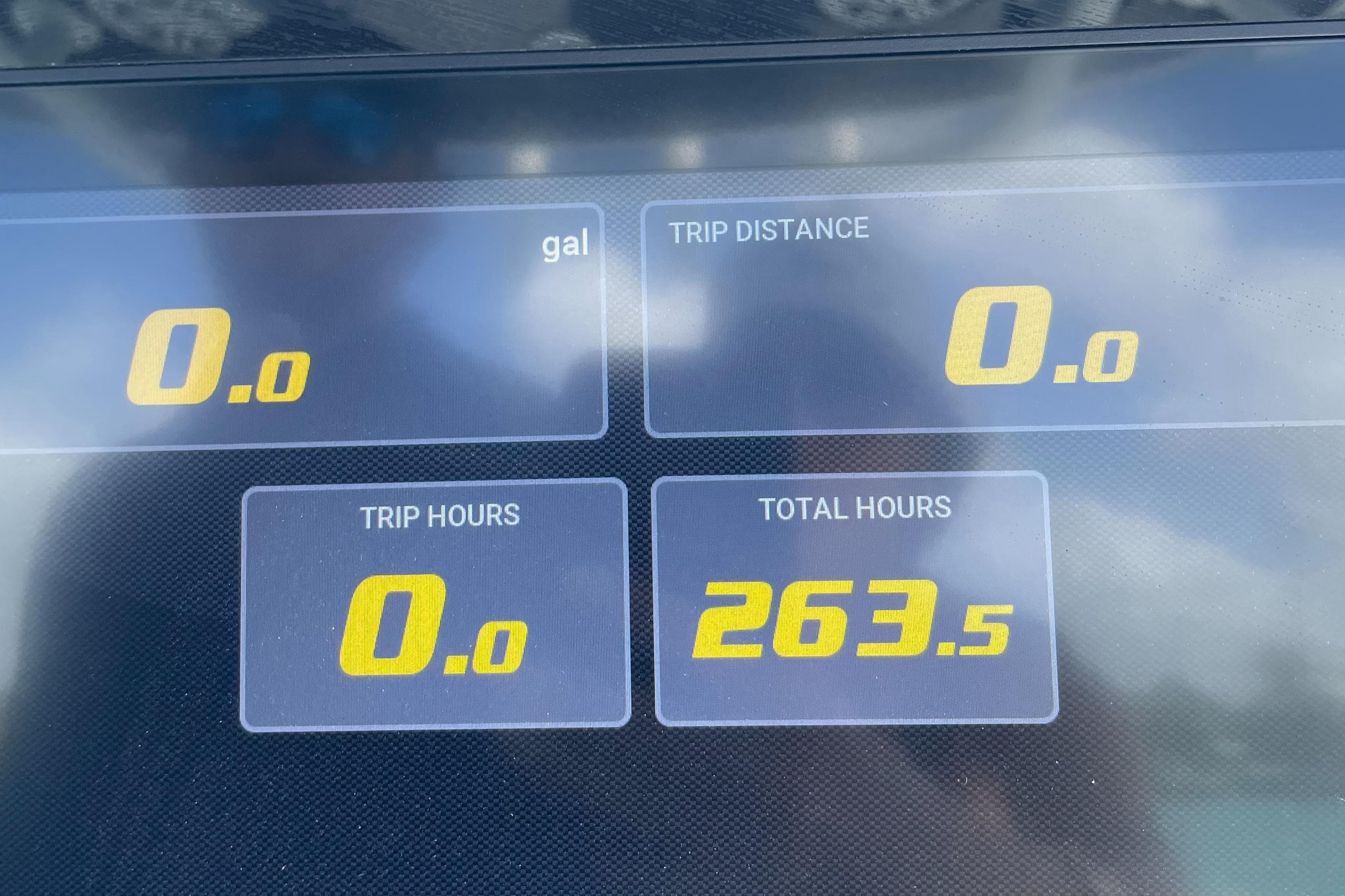 Dashboard display of a 2020 Sportsman Masters 267OE Bay Boat showing trip and total hours.
