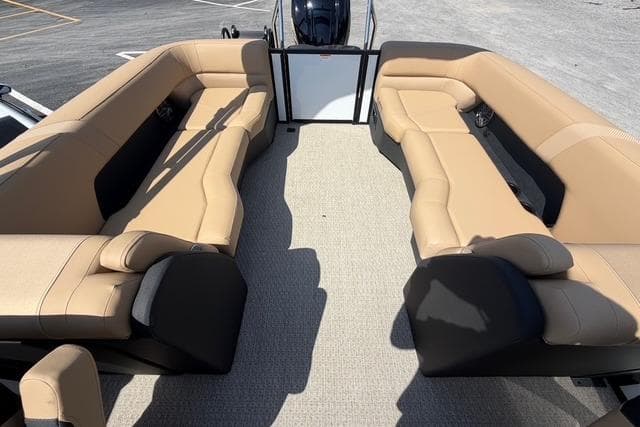 Luxurious seating on 2026 Evotti 523CS boat with beige upholstery and spacious layout.