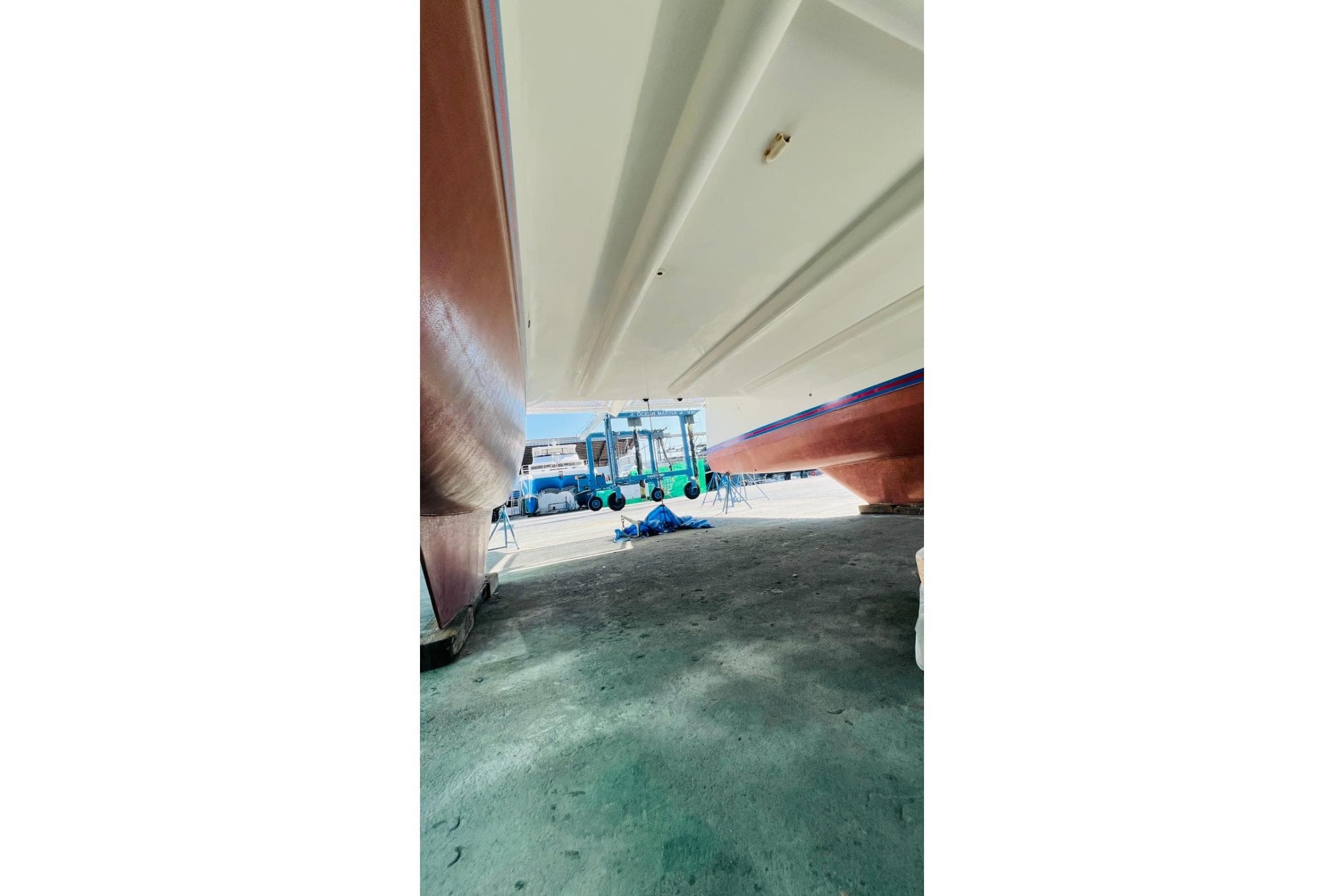 Underneath view of 2015 Island Spirit 380 catamaran in a boatyard.