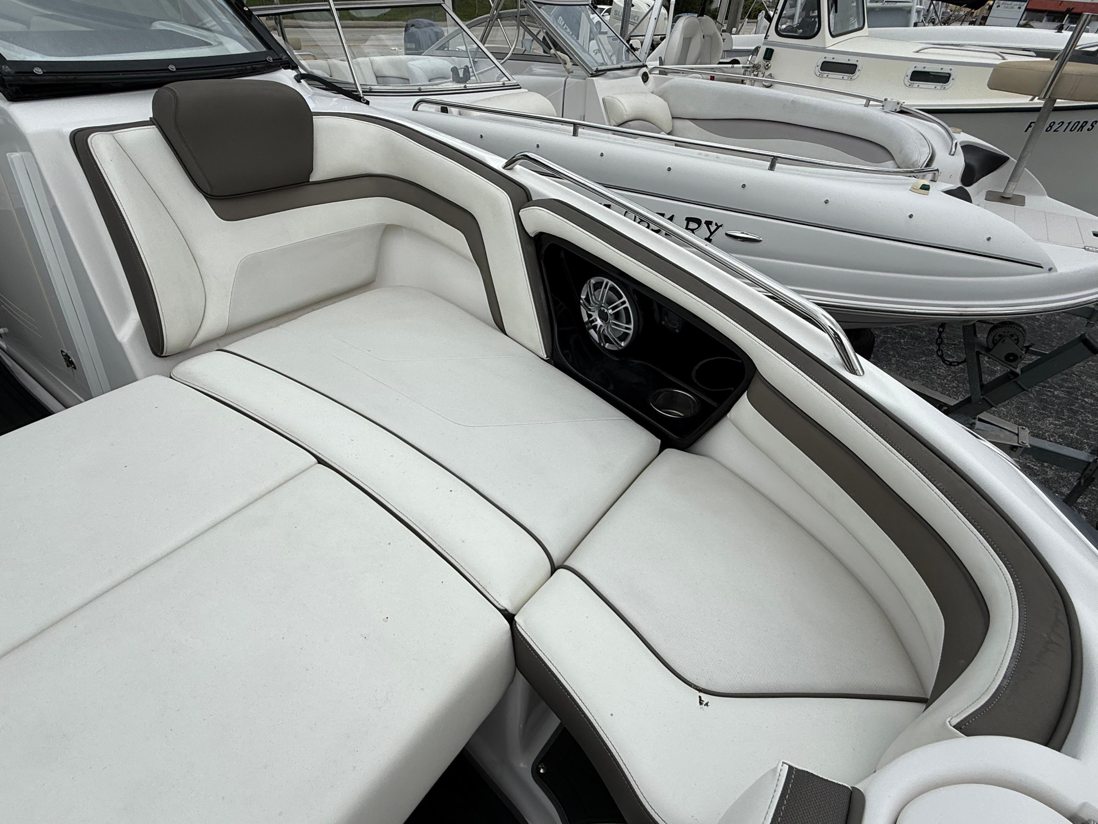 2016 Yamaha Boats 242 Limited S E-Series interior with white cushioned seating.