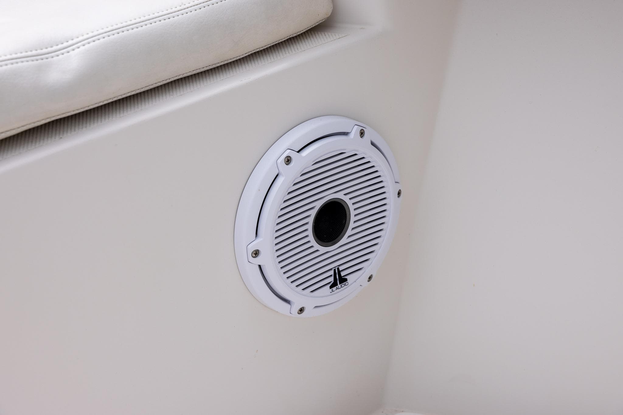 White speaker on a 2011 Jupiter 26 FS boat interior.