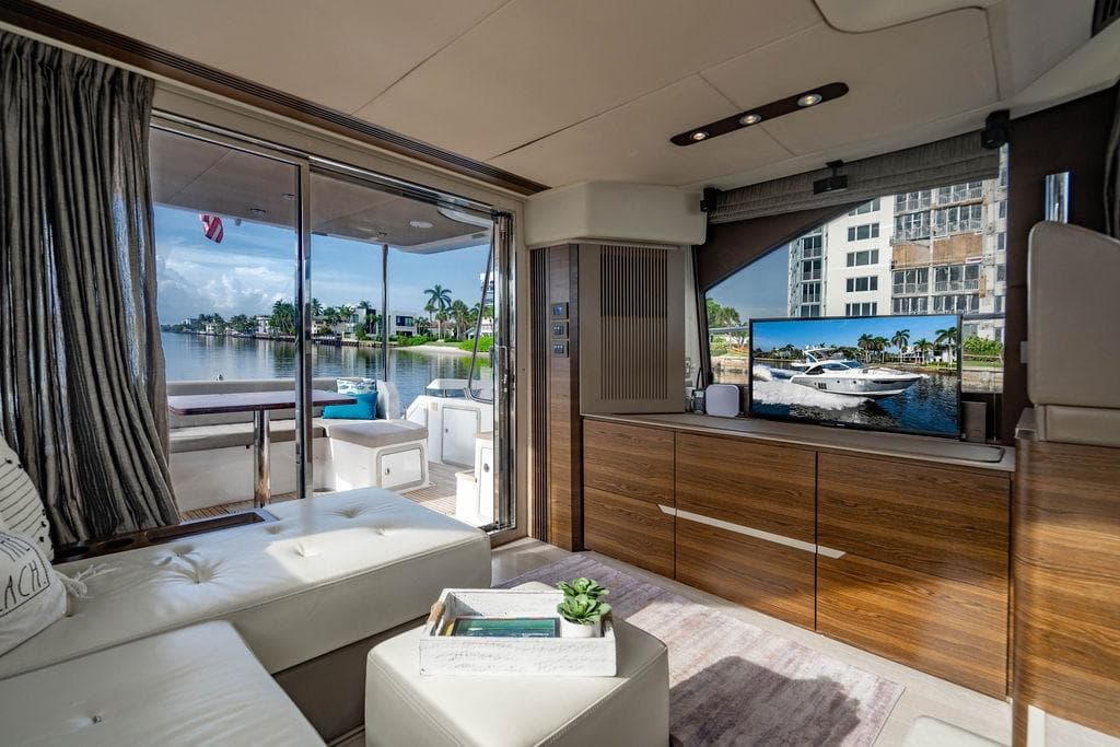 Luxurious interior of 2015 Azimut Fly 50 yacht with waterfront view and modern decor.