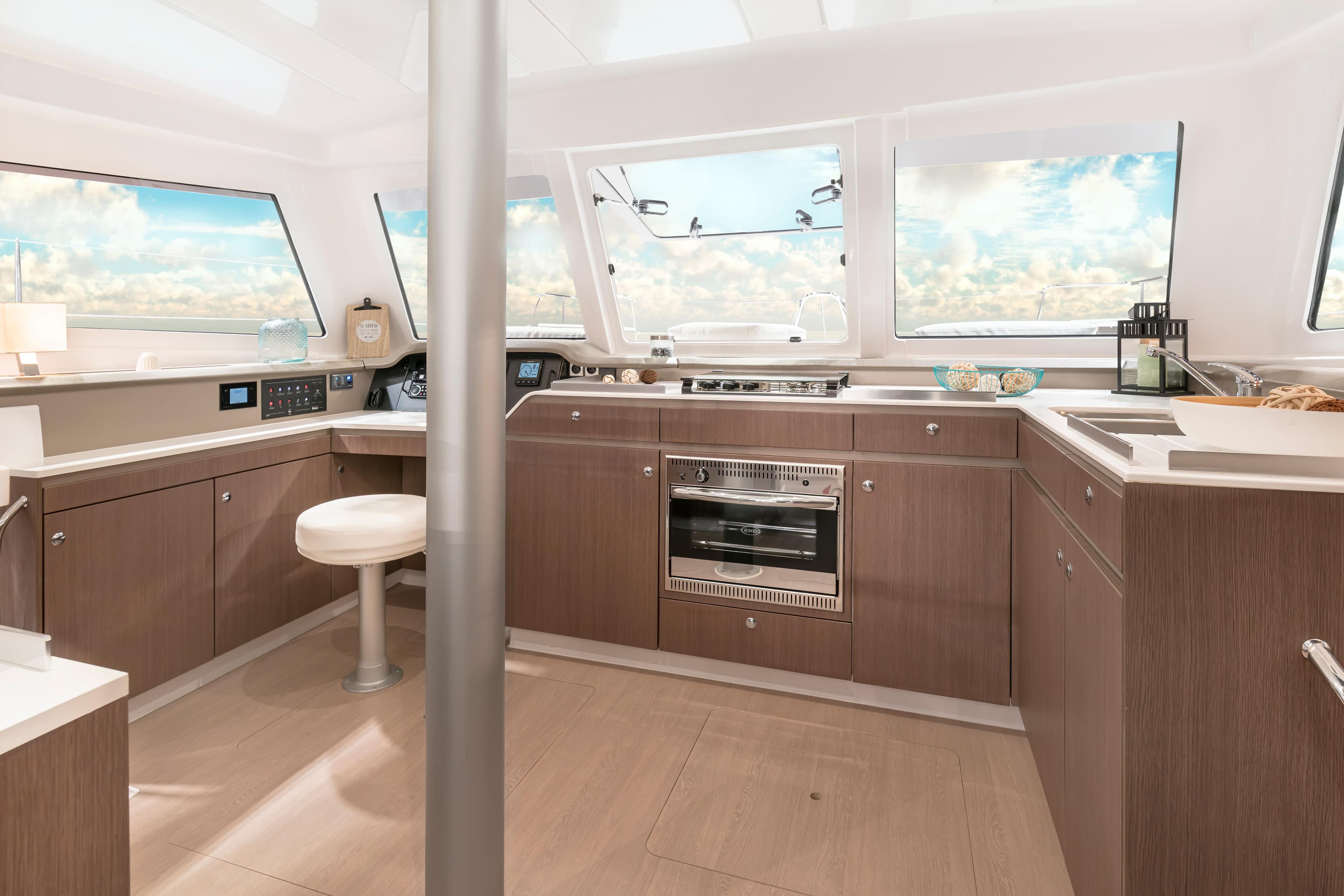 Modern kitchen interior of 2025 Bali CATSPACE SAIL yacht with panoramic windows.