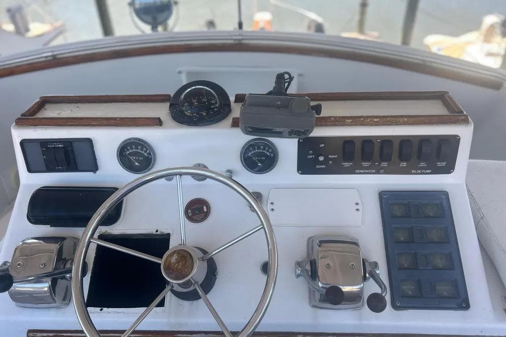 1978 Chris-Craft 45 Commander helm with steering wheel and control panel.