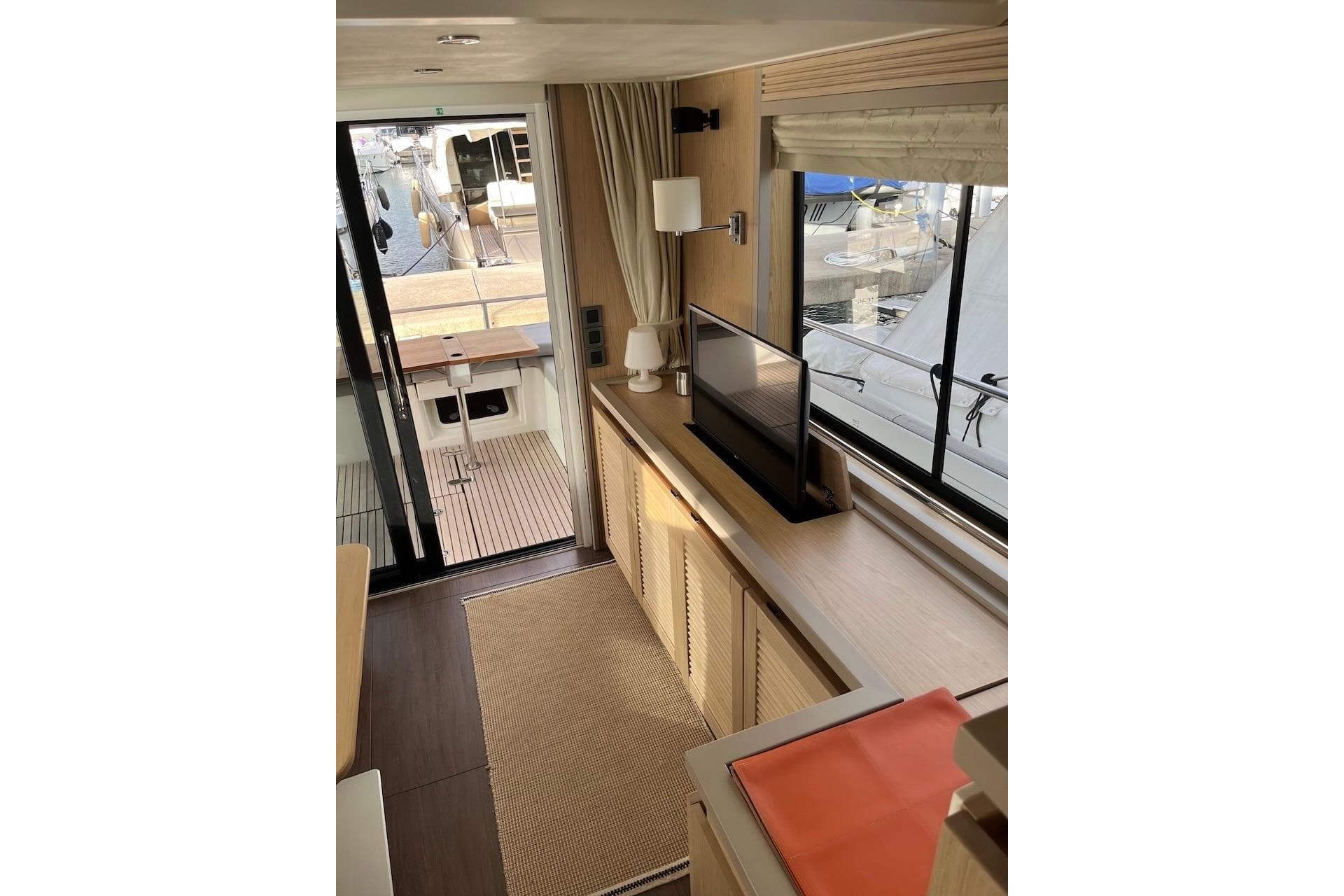 Interior of 2021 Beneteau Swift Trawler 50, featuring modern design and large windows.