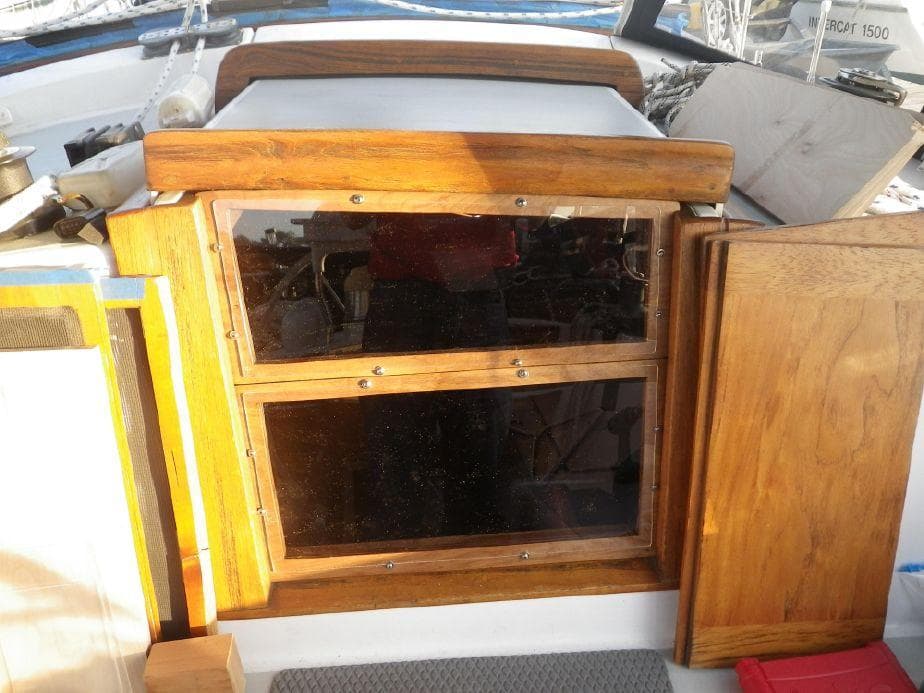 1981 Southern Cross 39' yacht cabin entrance with wooden doors and windows.