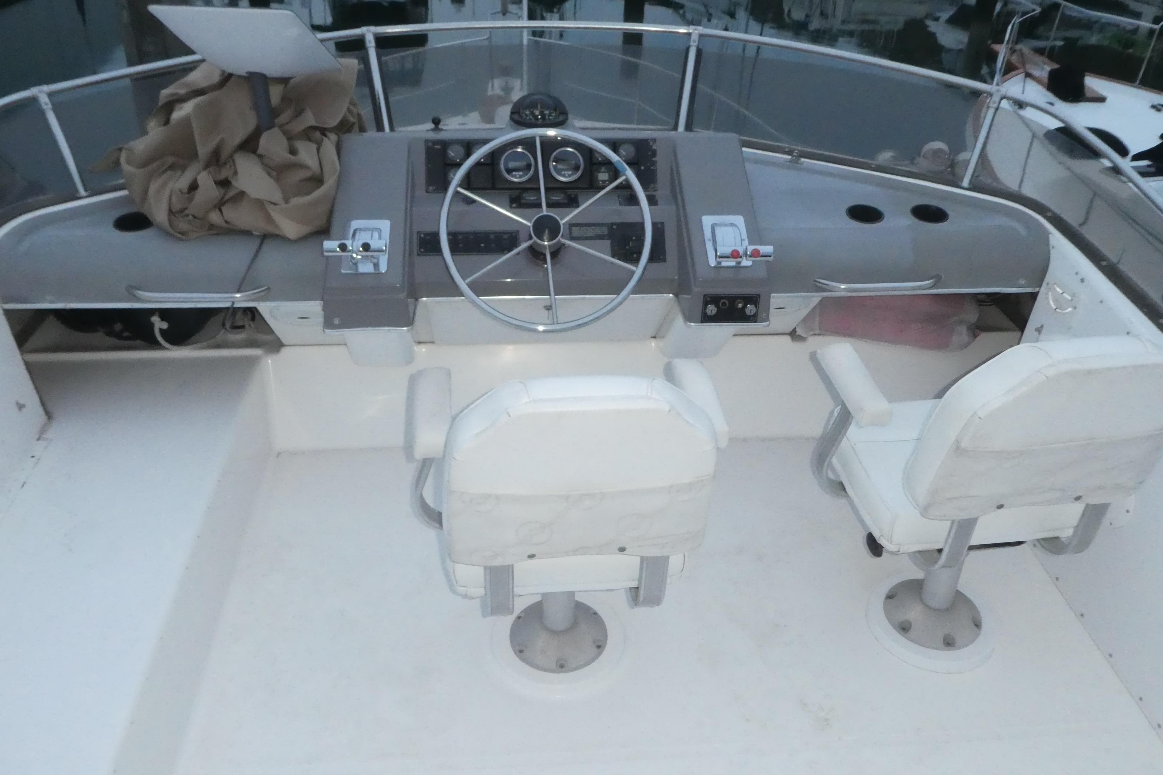 1994 Bayliner 4388 Motor Yacht helm with dual seats and steering wheel.