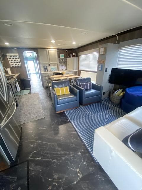 Interior of a 1992 Jamestowner 16x72 houseboat with modern furnishings and kitchen.