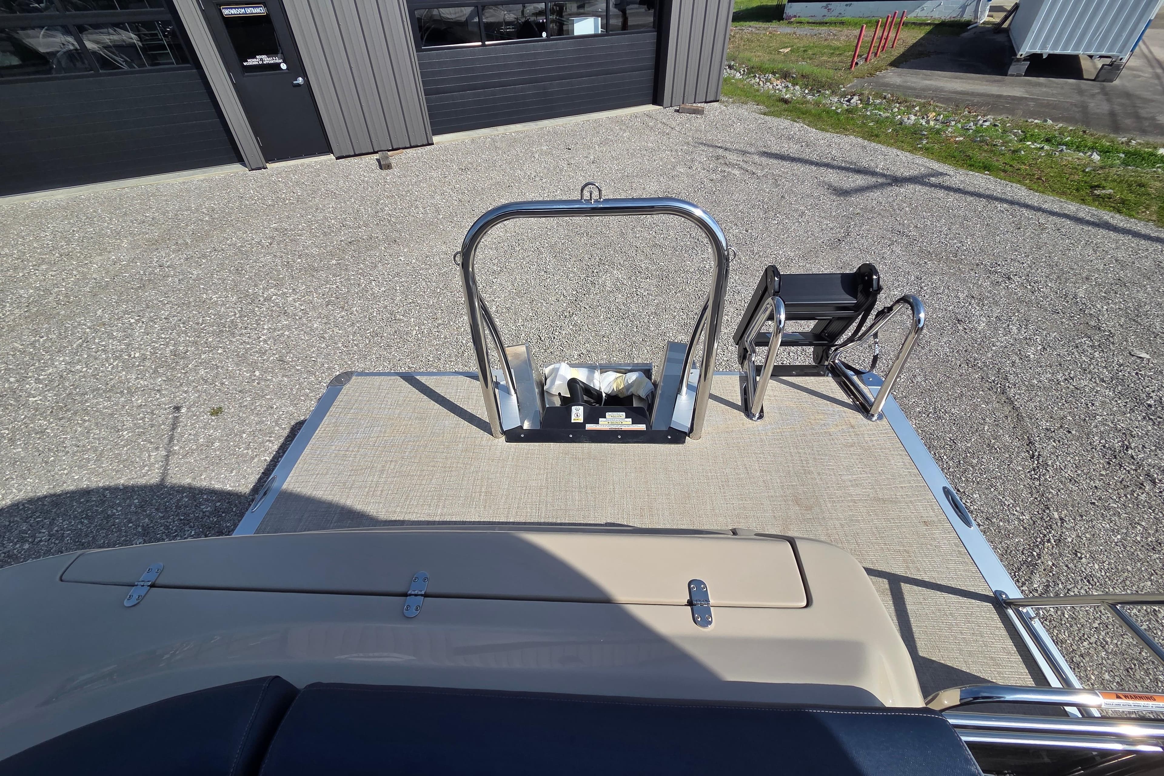 2026 Avalon Platinum Catalina 2585 Windshield Elite boat deck with ladder and railing.
