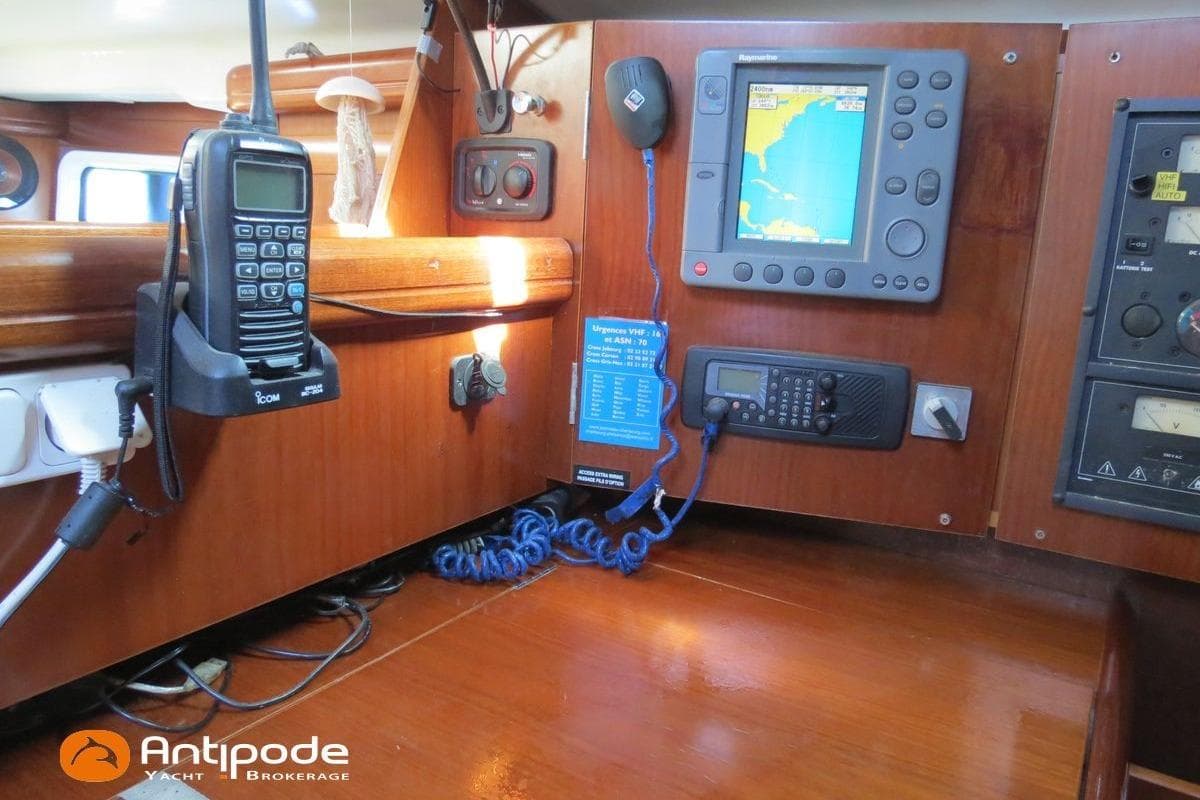 Navigation equipment on a 2003 Beneteau Oceanis 411 yacht, featuring communication devices and control panels.