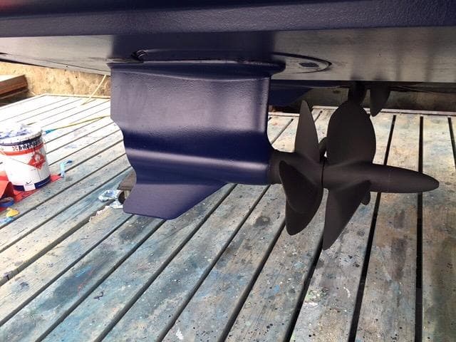 Propeller of 2012 Sunseeker Portofino 48 yacht on a wooden dock.