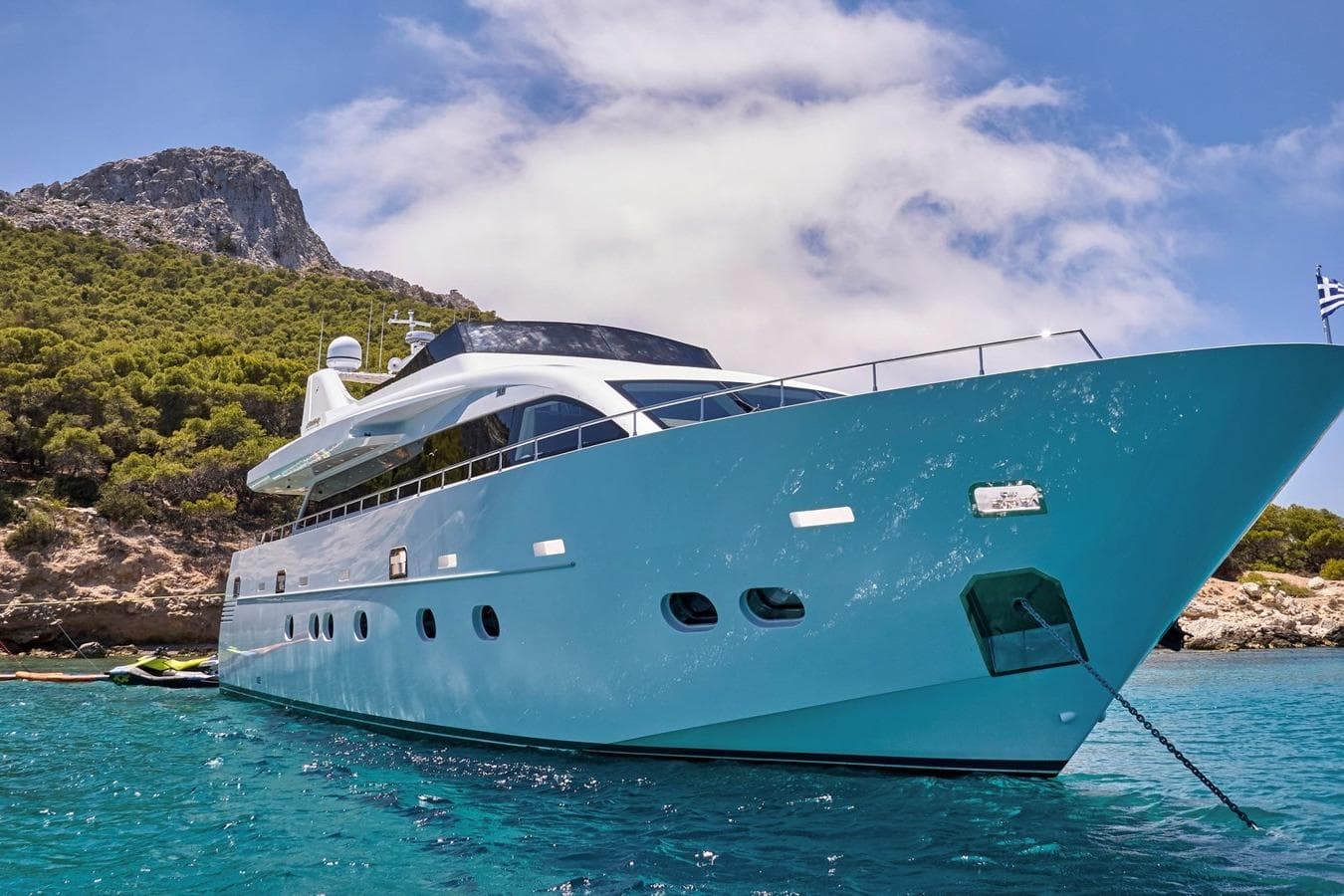 Luxury Admiral 25 yacht from 2008 anchored in scenic coastal waters.