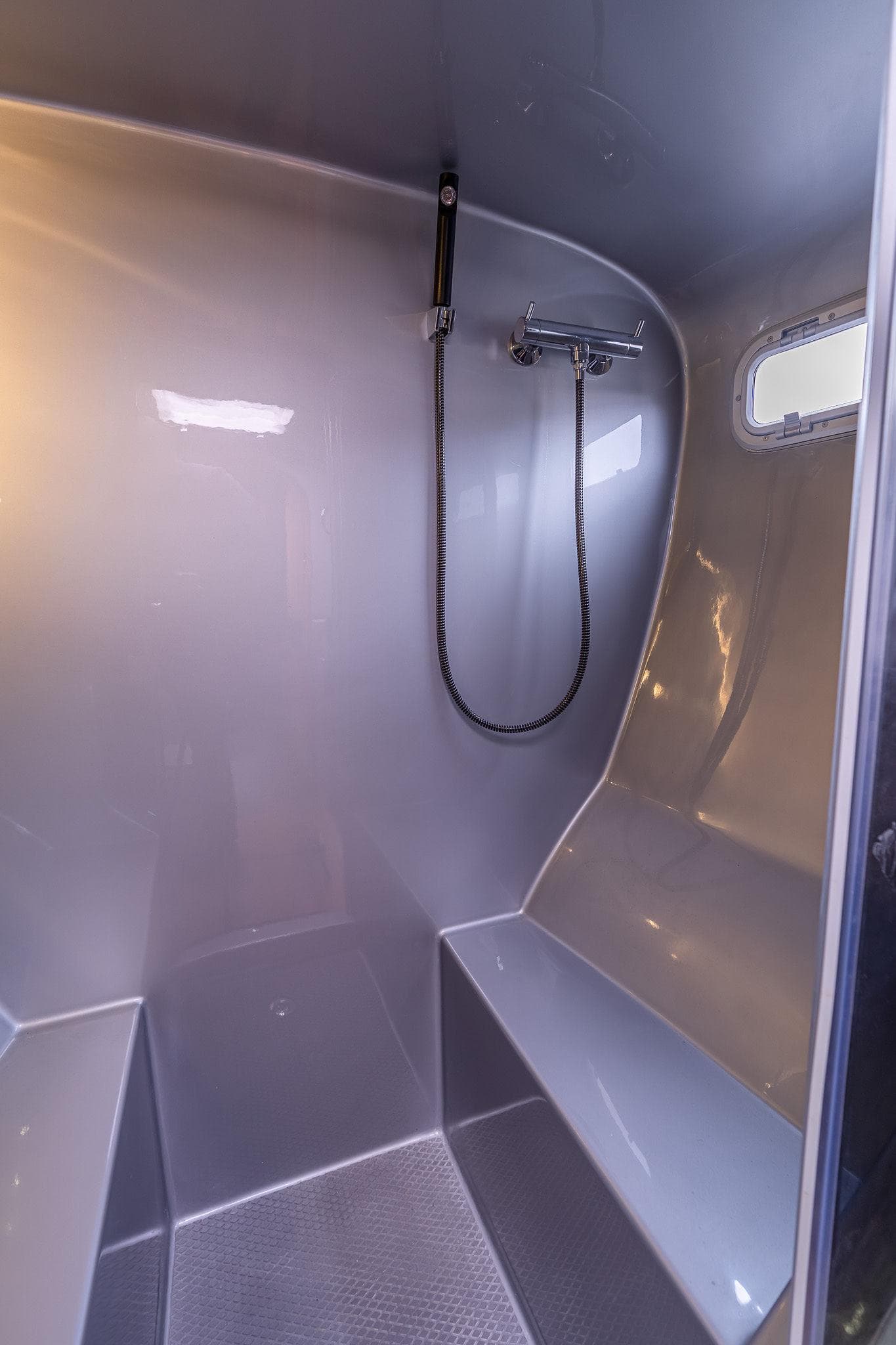 Modern shower area in 2025 Shuttleworth 52 AeroRig yacht, featuring sleek design and built-in seating.