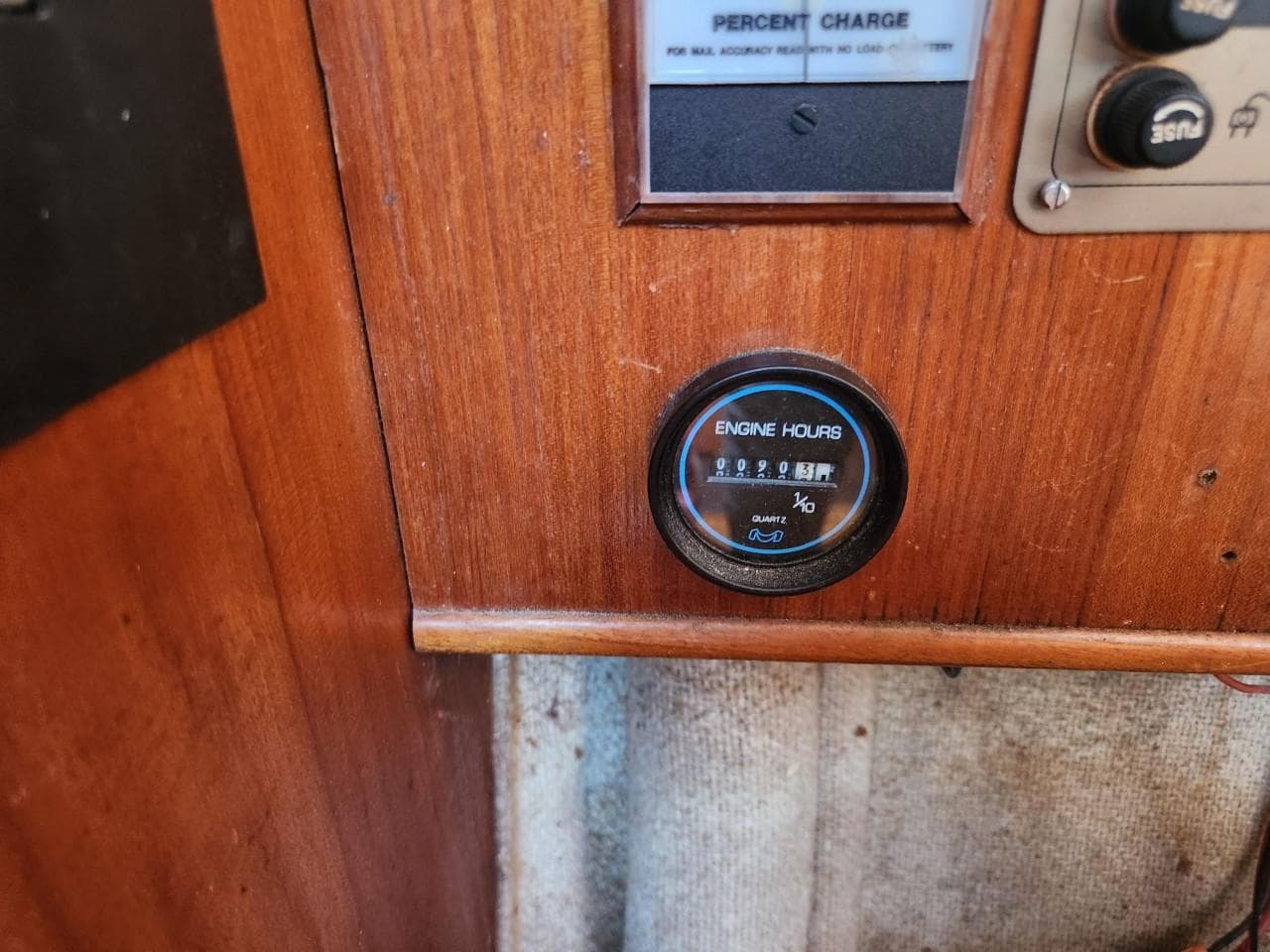 Engine hours gauge on 1984 Elite 32 boat dashboard.