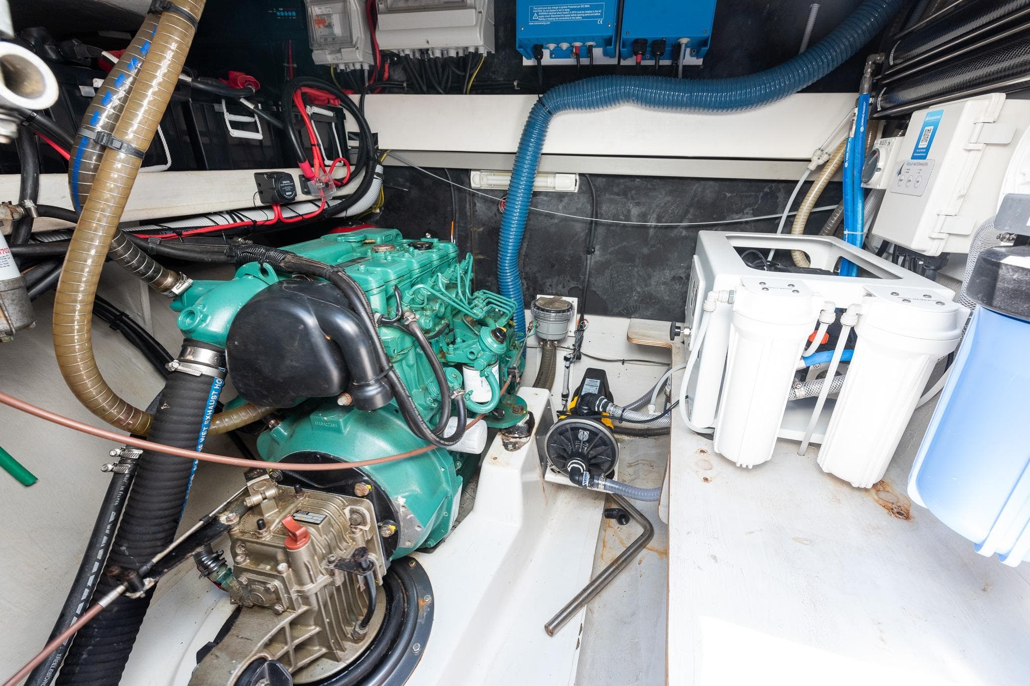 Engine room of 2011 Fountaine Pajot Salina 48 catamaran, showcasing mechanical components and wiring.