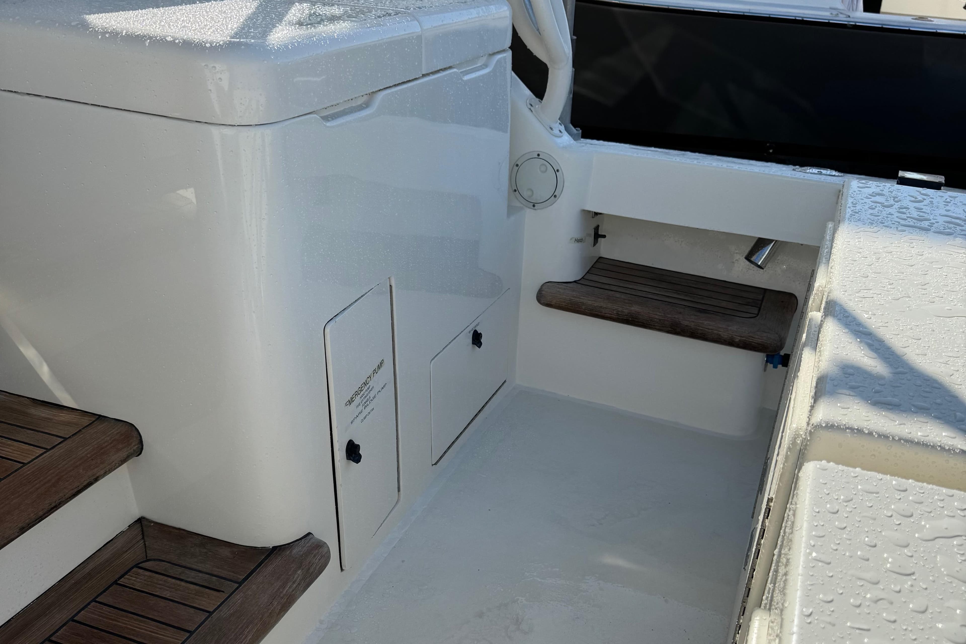 2007 Albemarle 410 Express Fisherman boat interior with wooden steps and storage compartments.