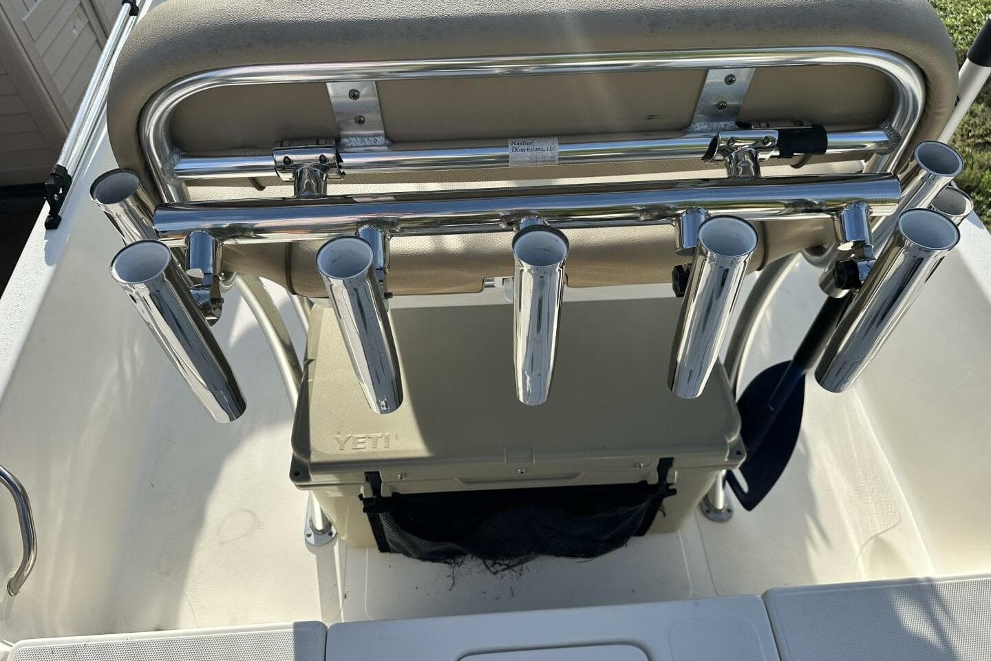 2020 NauticStar 2140 Sport Shallow Bay boat with rod holders and Yeti cooler.