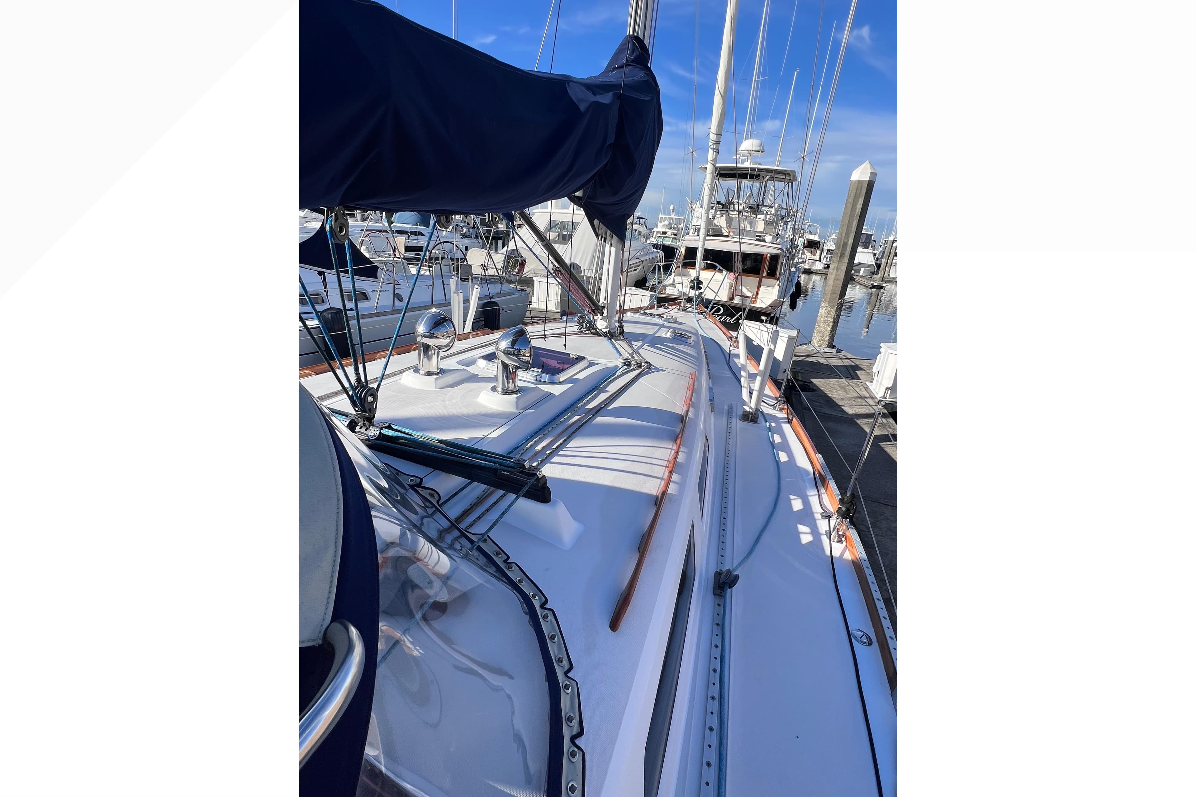 2006 Sabre 426 sailboat docked at marina, showcasing deck and rigging.