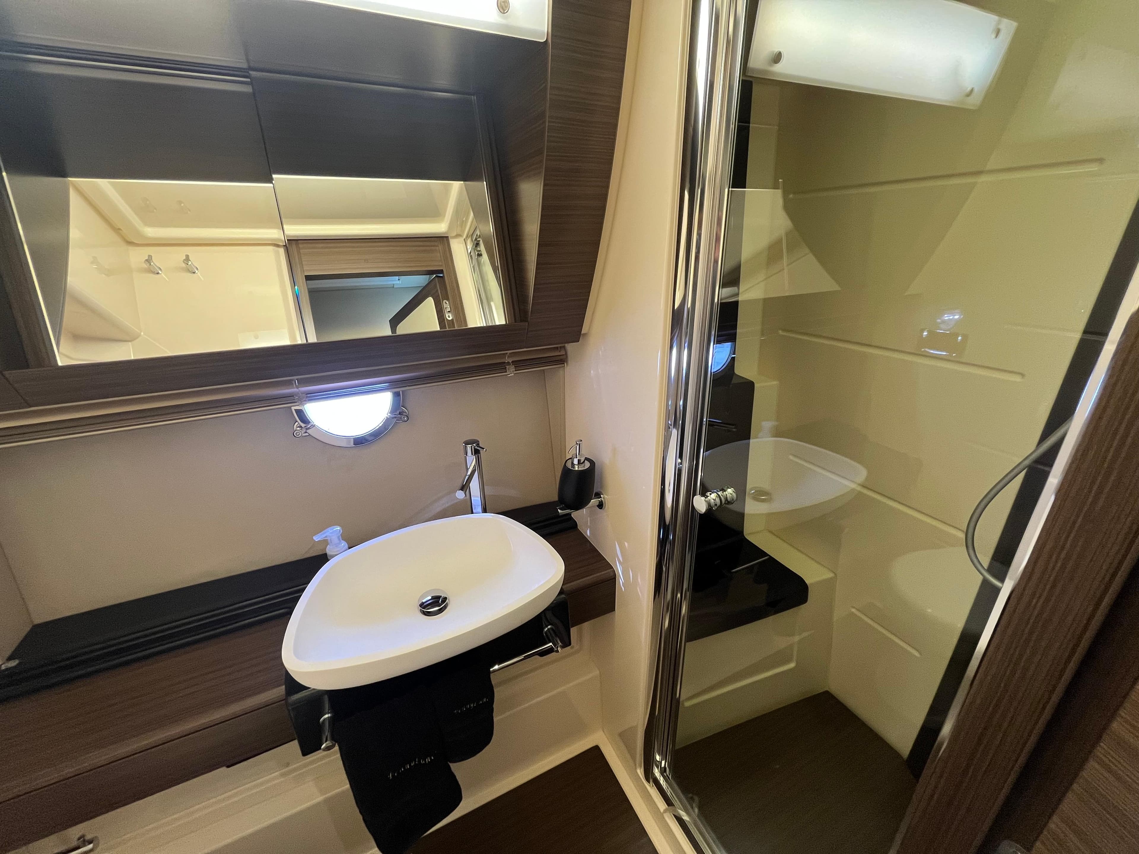 Luxurious bathroom in 2014 Azimut 55S yacht with modern sink and shower.