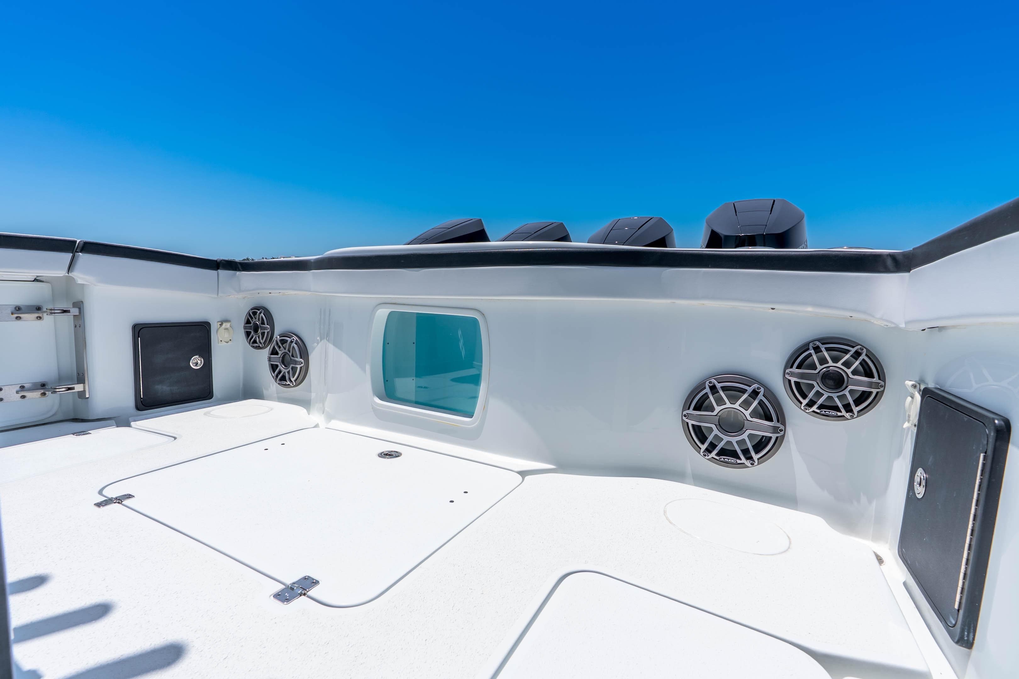 2024 Yellowfin 42 Offshore boat deck with speakers and storage compartments.