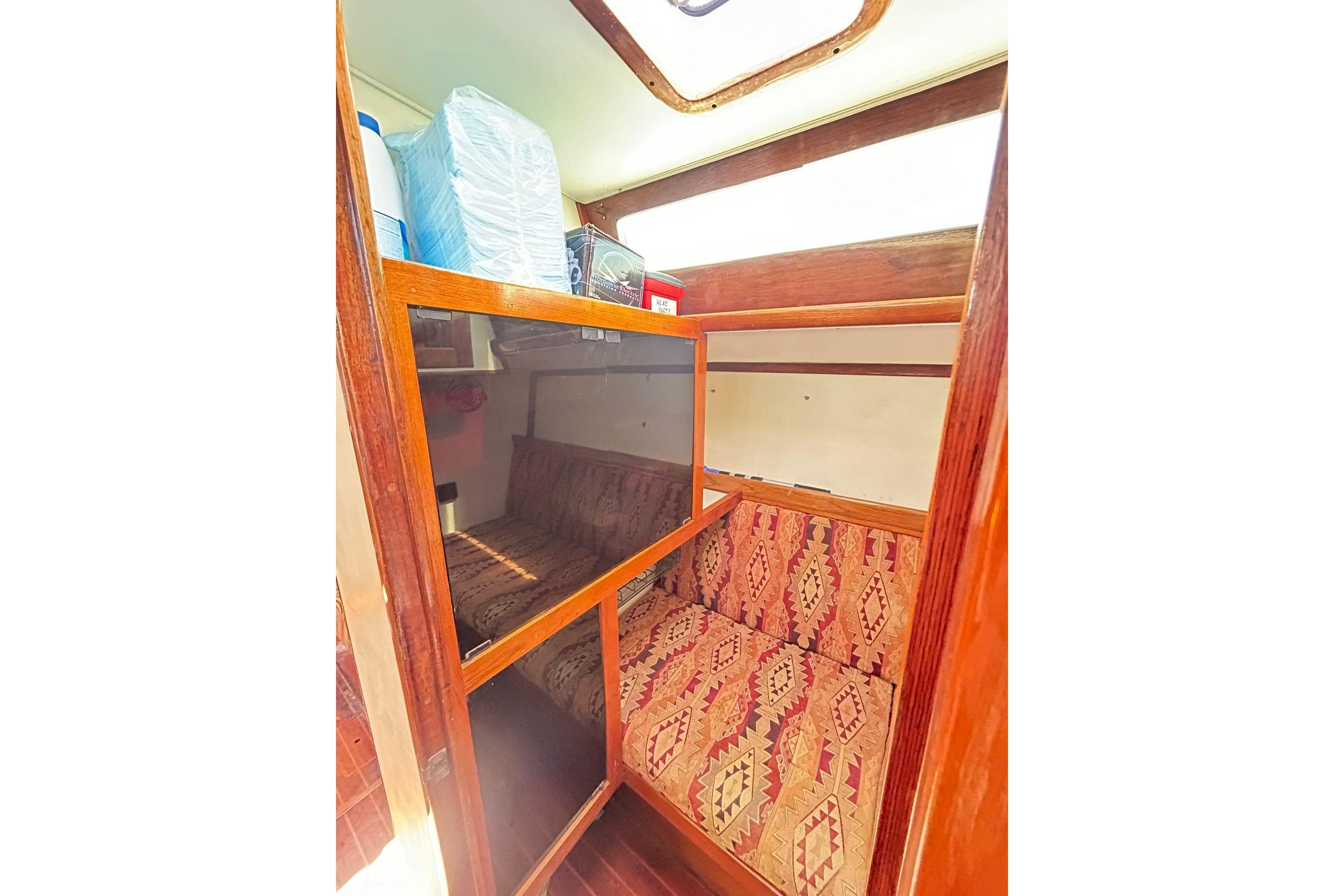 1987 Gulfstar CSY 50 Pilot House interior with patterned seating and wooden accents.