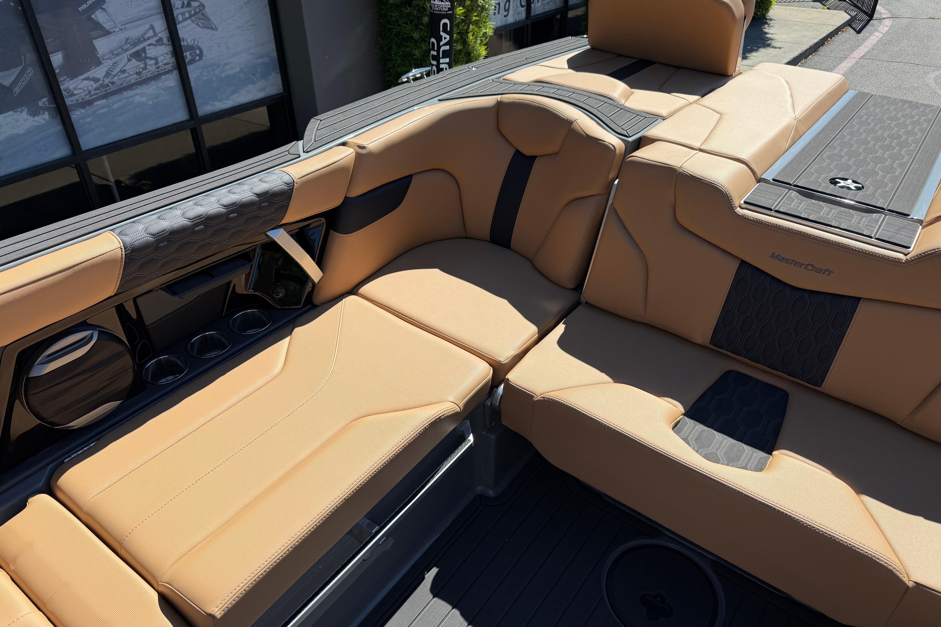Luxurious tan seating on 2026 MasterCraft XT24 boat, featuring sleek design and premium materials.
