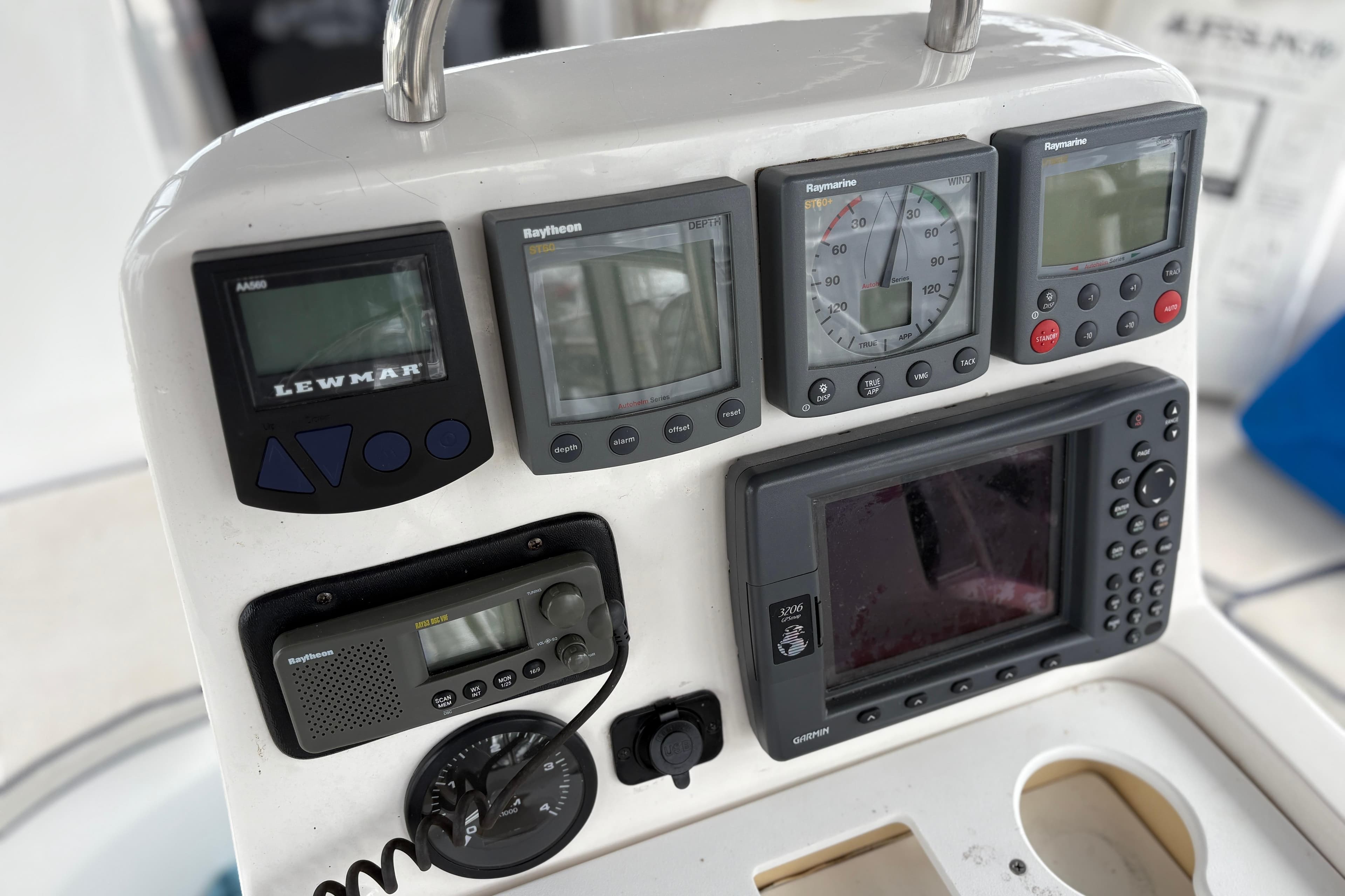 Control panel of a 2002 Hunter 386 sailboat with navigation instruments and displays.