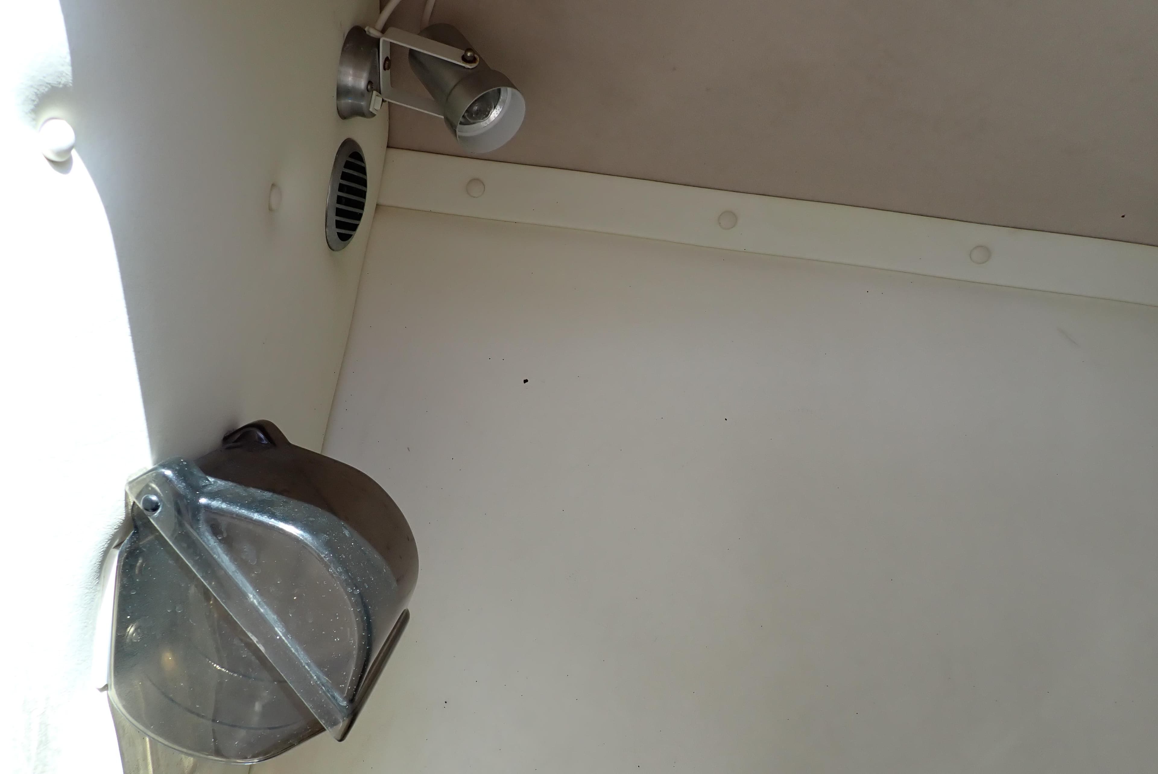 Interior of a 2002 Cobalt 240 boat showing a light fixture and ventilation.