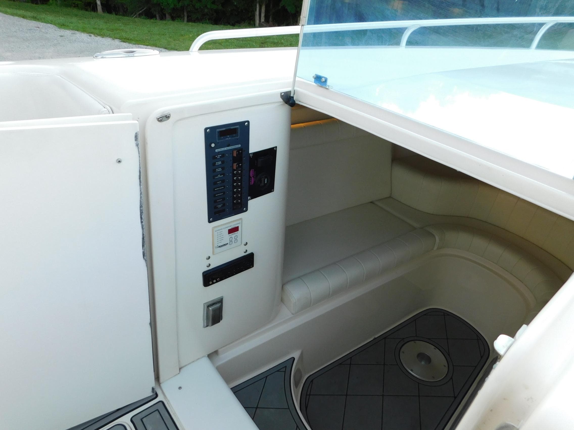 Interior view of a 2005 Solid Craft LIMITED 40 boat, featuring seating and control panel.