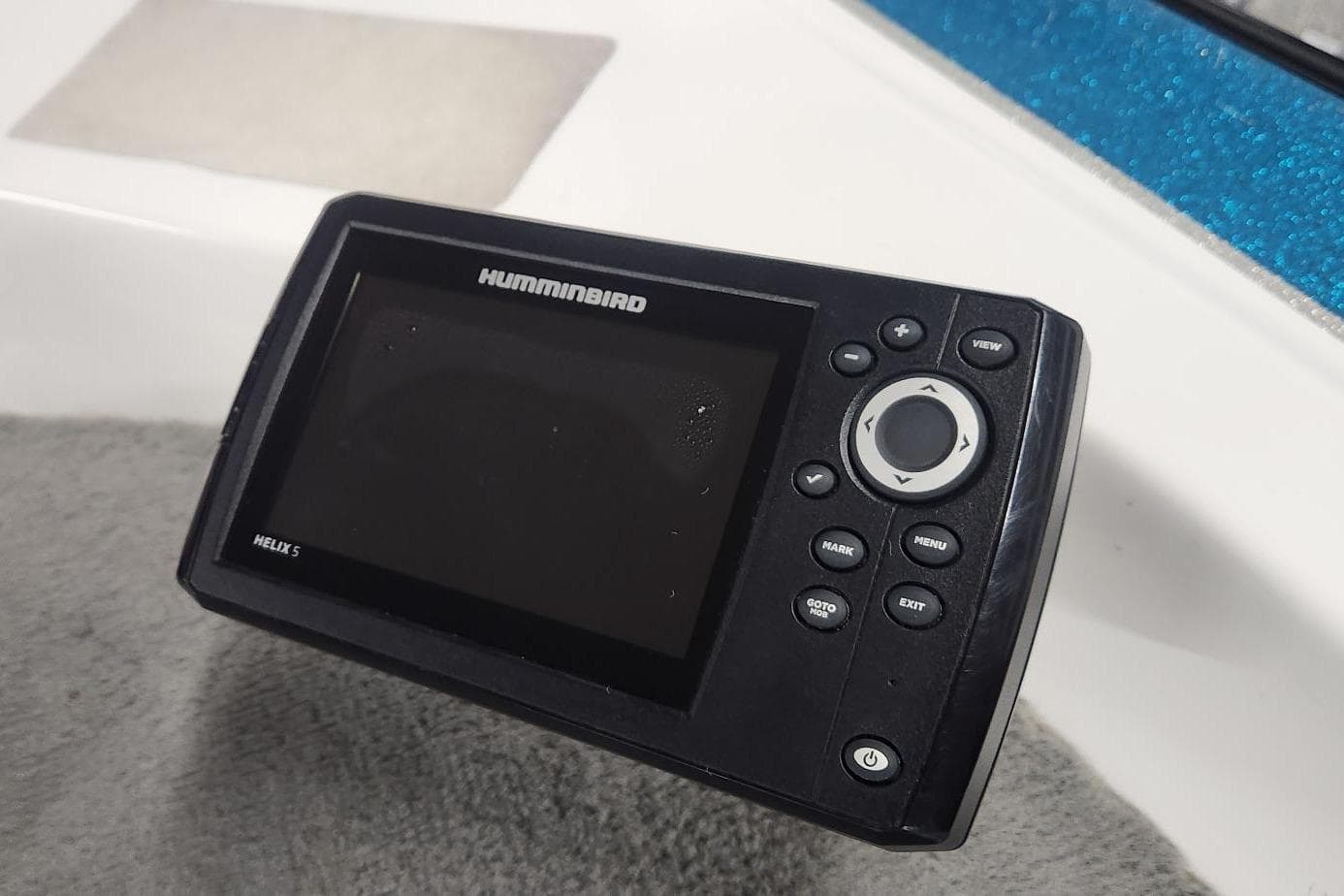 Humminbird Helix 5 fish finder on 1997 Stratos 268V bass boat dashboard.
