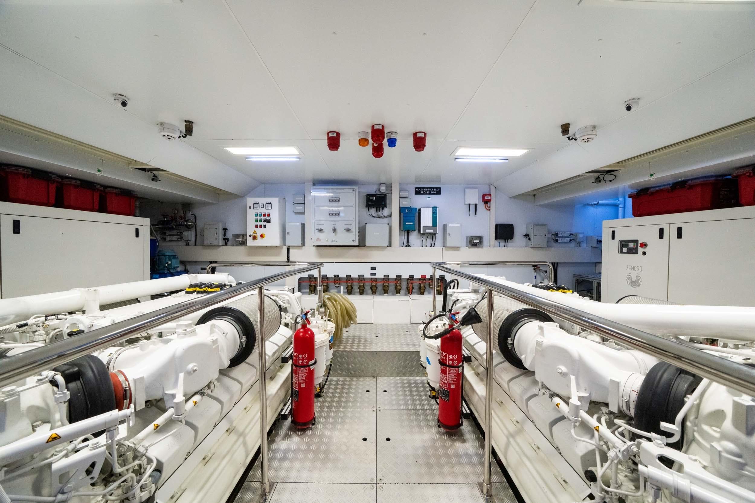 Engine room of 2023 Riva 130' Bellissima yacht, featuring advanced machinery and safety equipment.