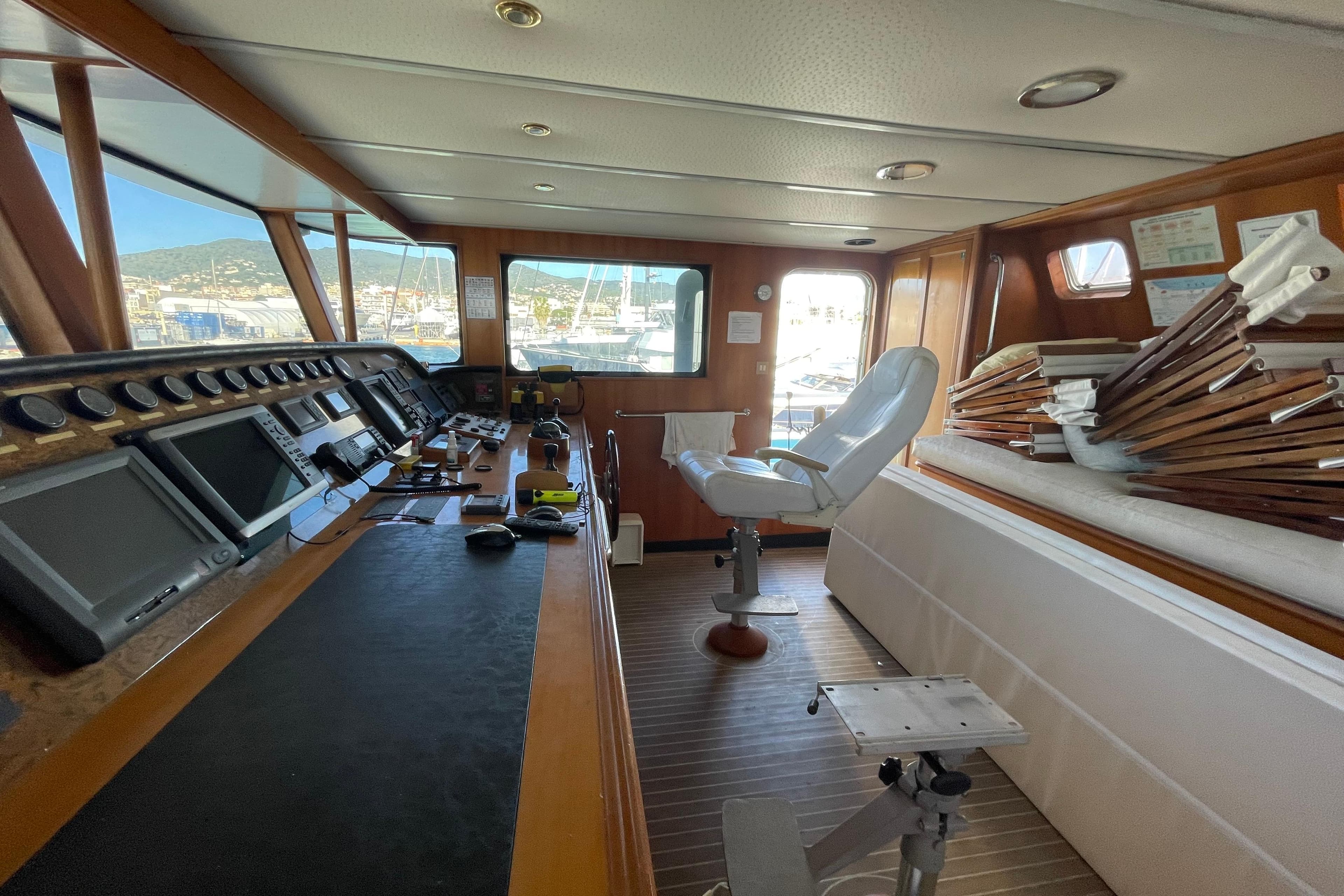 Interior of 2005 ATB Maroc Custom 28.8 ship with control panel and seating.
