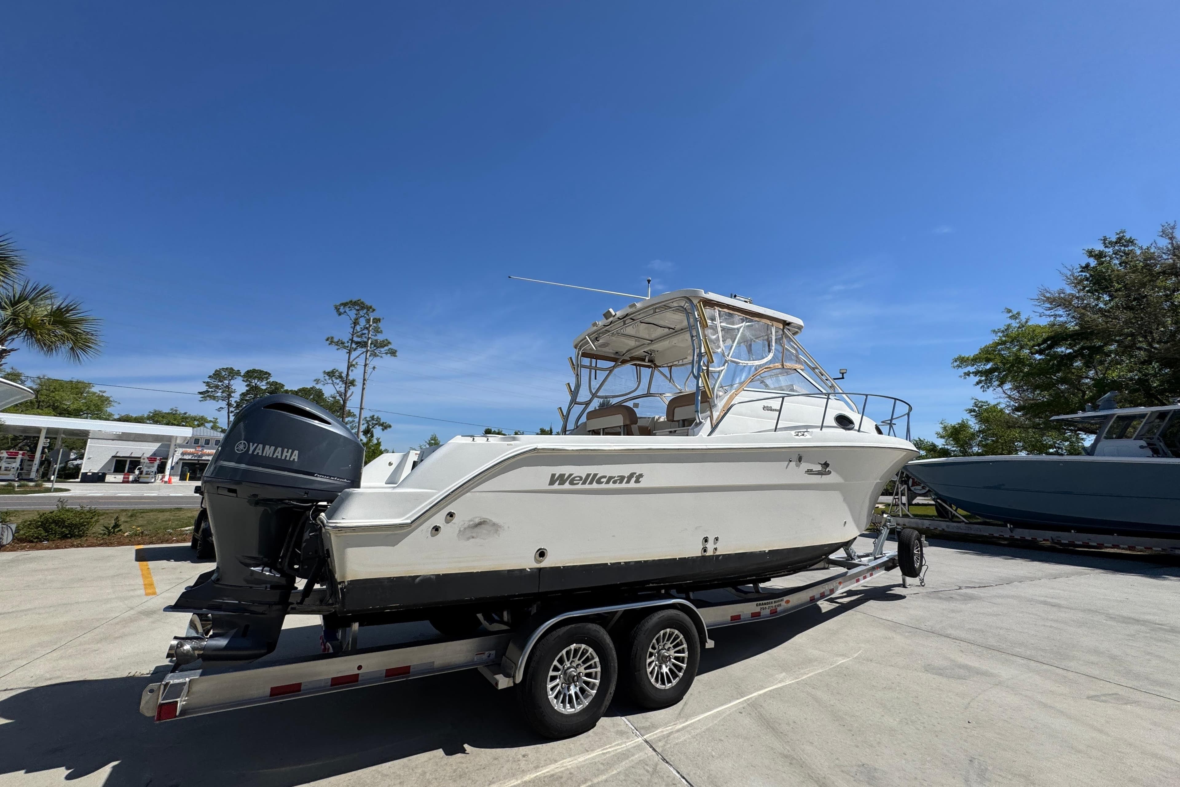2004 Wellcraft 290 Coastal boat on trailer with Yamaha outboard motor.