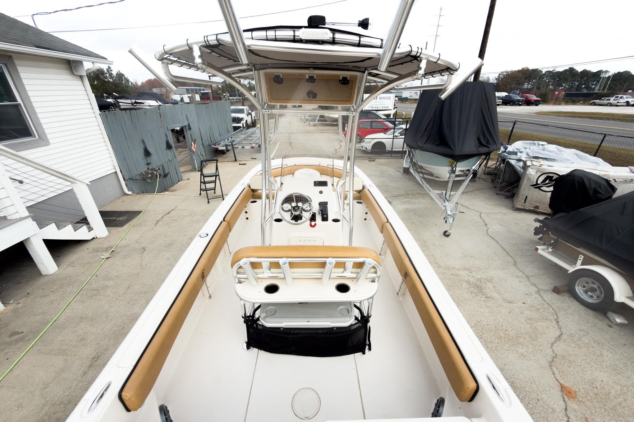 2025 Carolina Skiff 21 Ultra Elite boat, docked, showcasing spacious interior and helm.