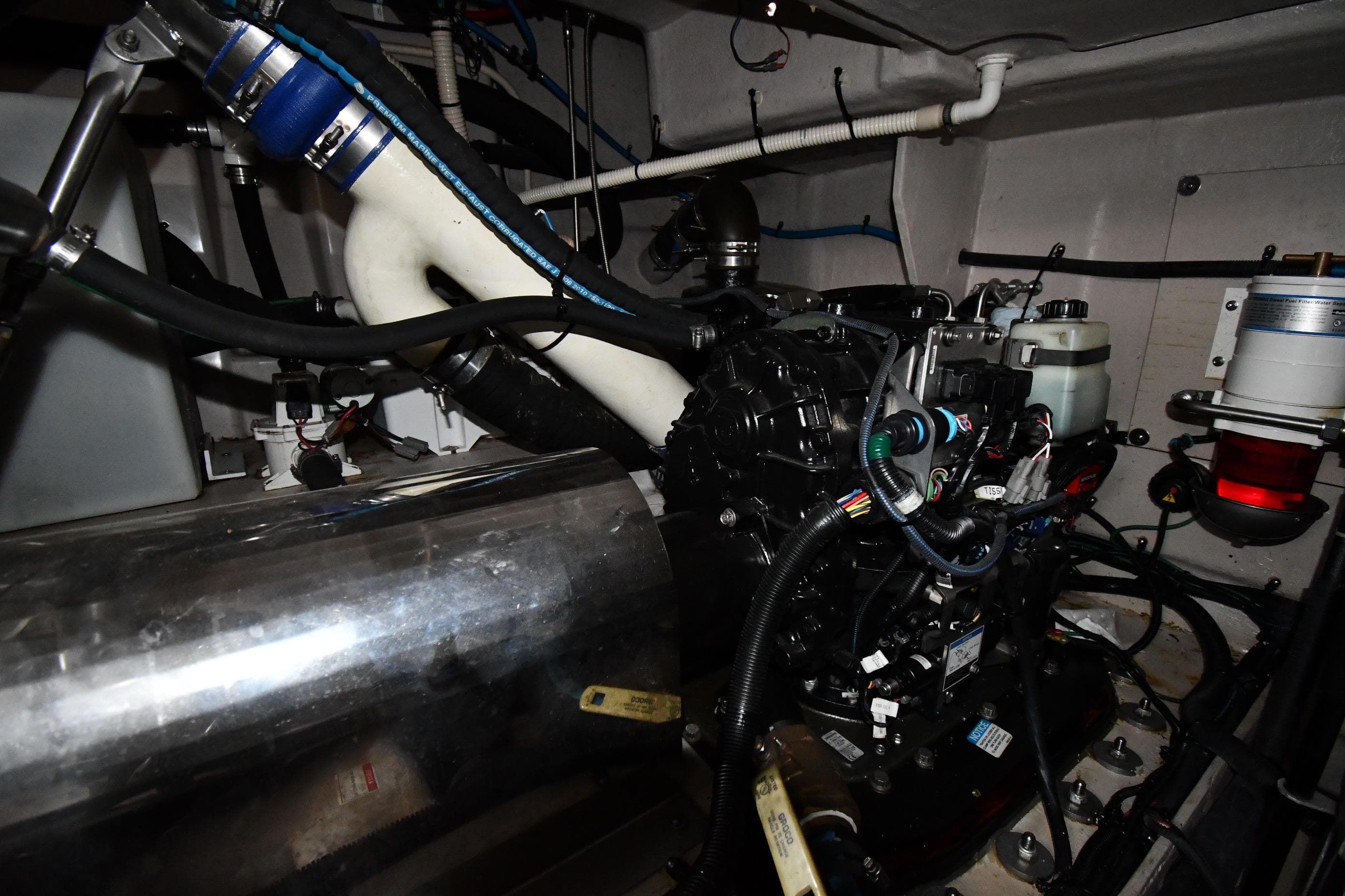 Engine room of 2013 Sea Ray Sundancer 540 yacht, showcasing mechanical components and wiring.