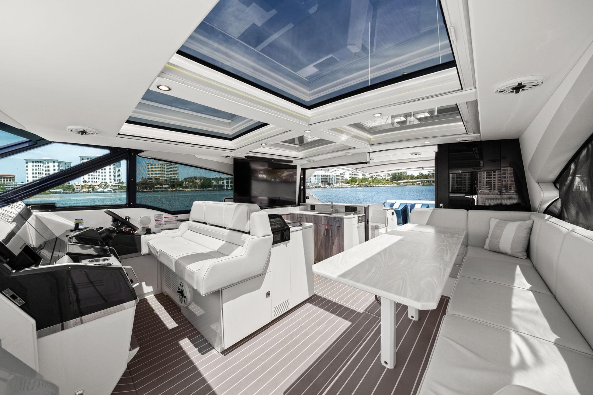 Luxurious interior of 2025 Formula 500 Super Sport Crossover yacht with panoramic windows and seating.