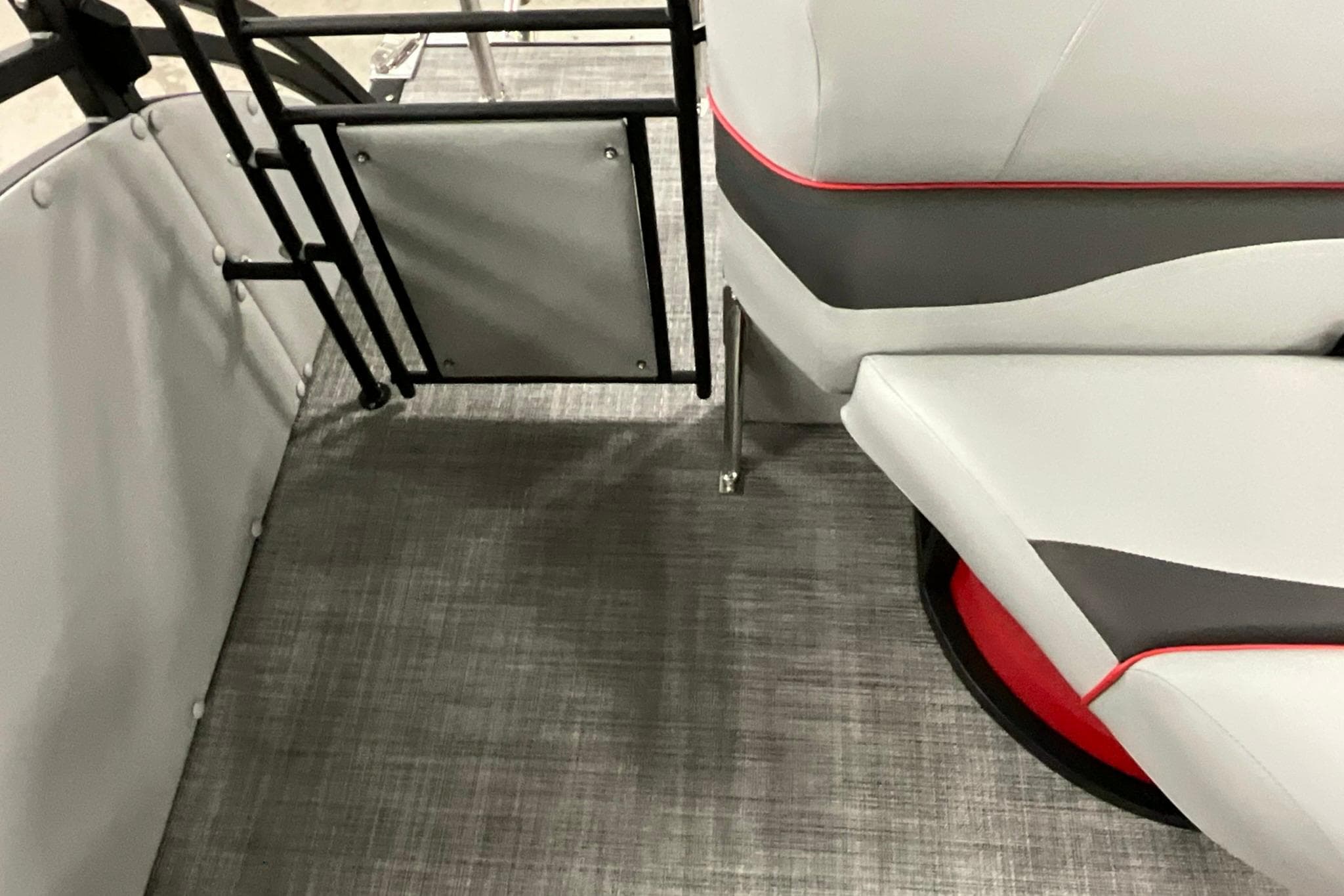 Interior of 2026 JC NEPTOON SPORT 21TT boat with modern seating and flooring.