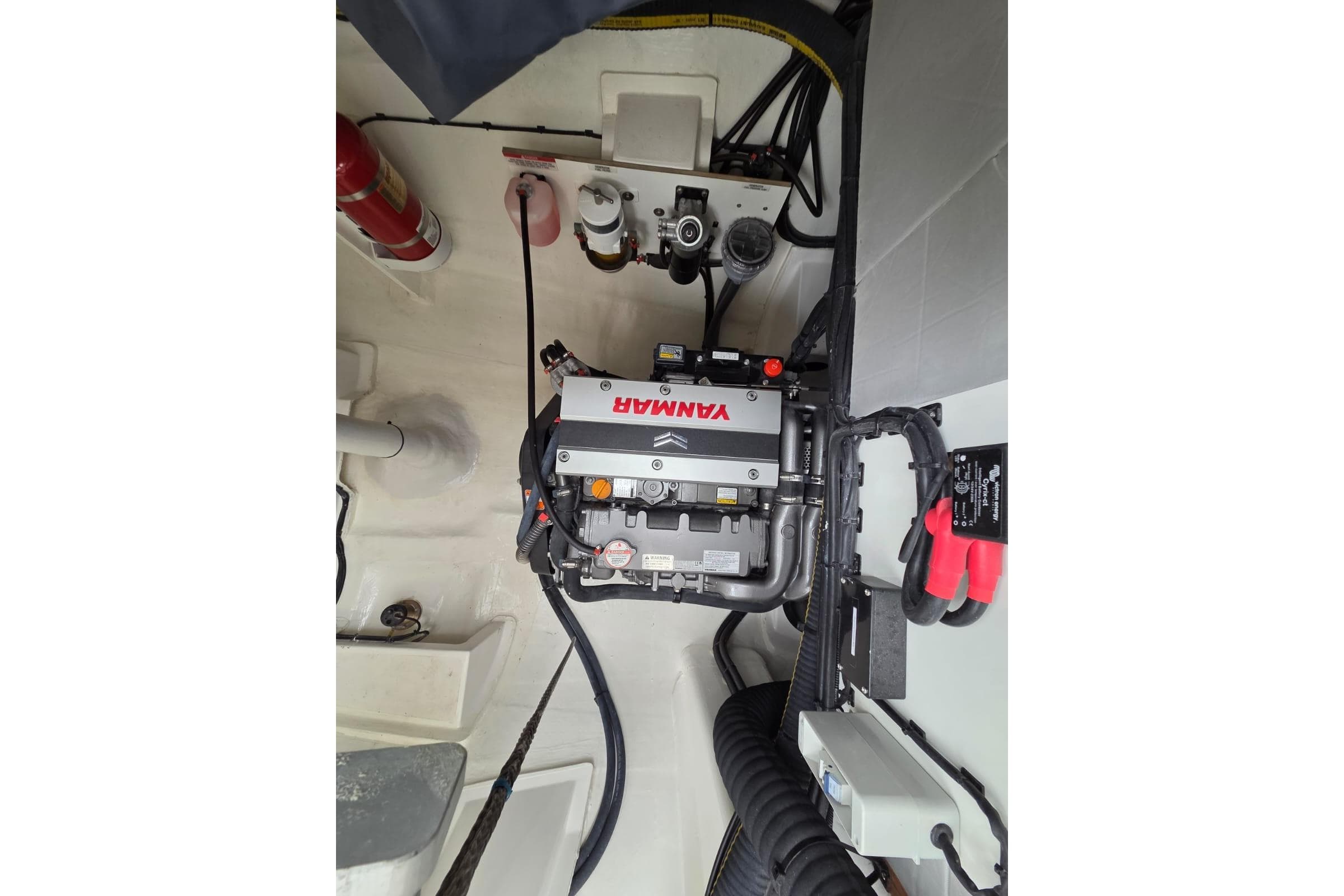 Engine compartment of 2024 Leopard 50 yacht with Yanmar engine and fire extinguisher.