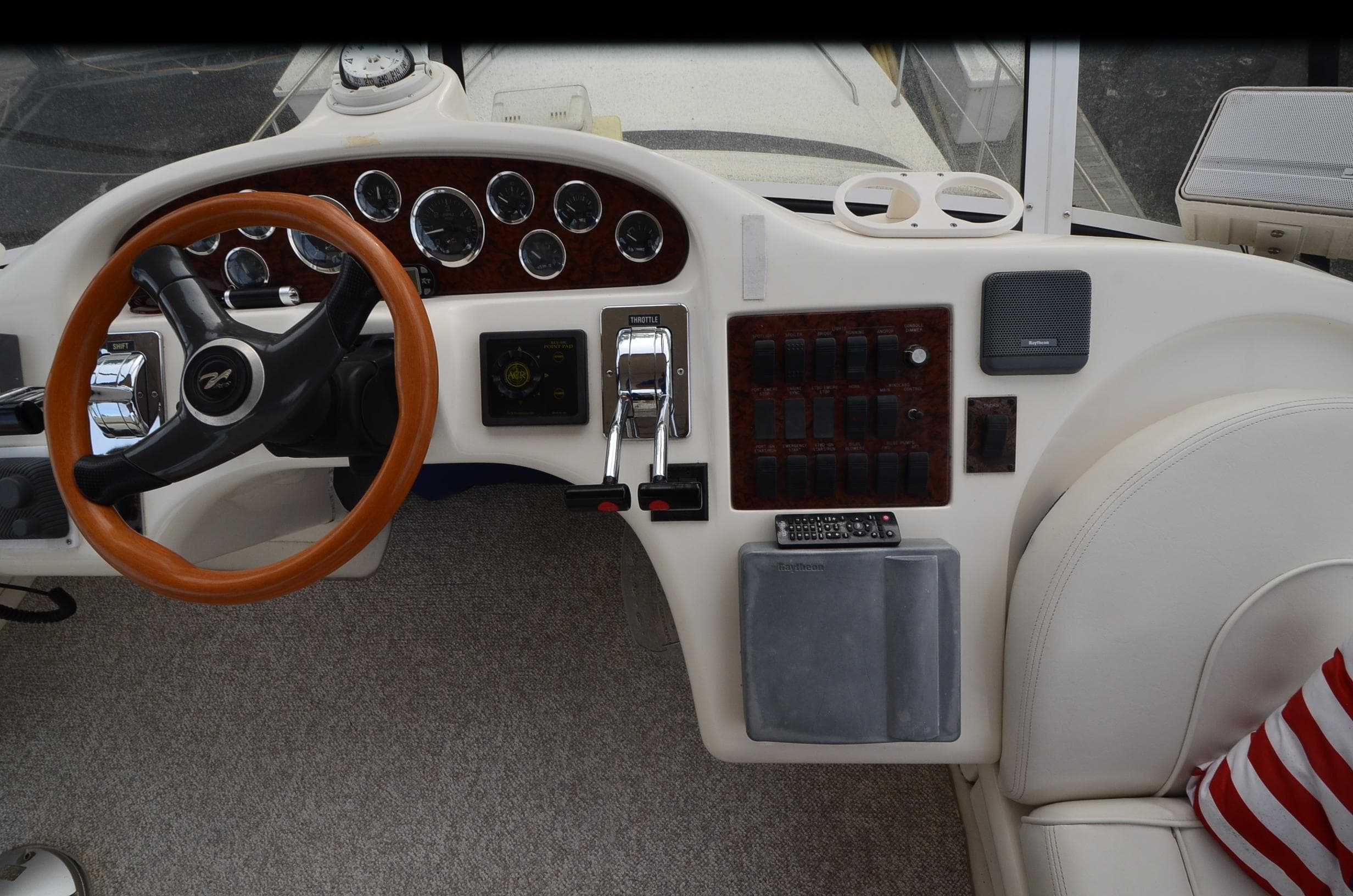Helm of 2000 Sea Ray 420 Aft Cabin with steering wheel and control panel.
