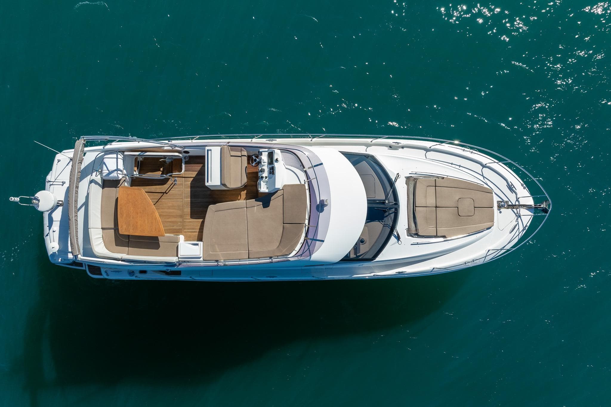 Aerial view of 2017 Prestige 500 yacht on clear blue water.