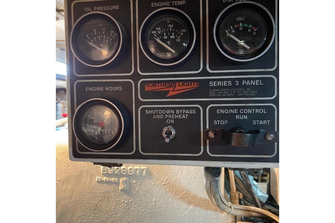 Control panel of a 1988 Burger 80 Motor Yacht, featuring gauges and engine controls.