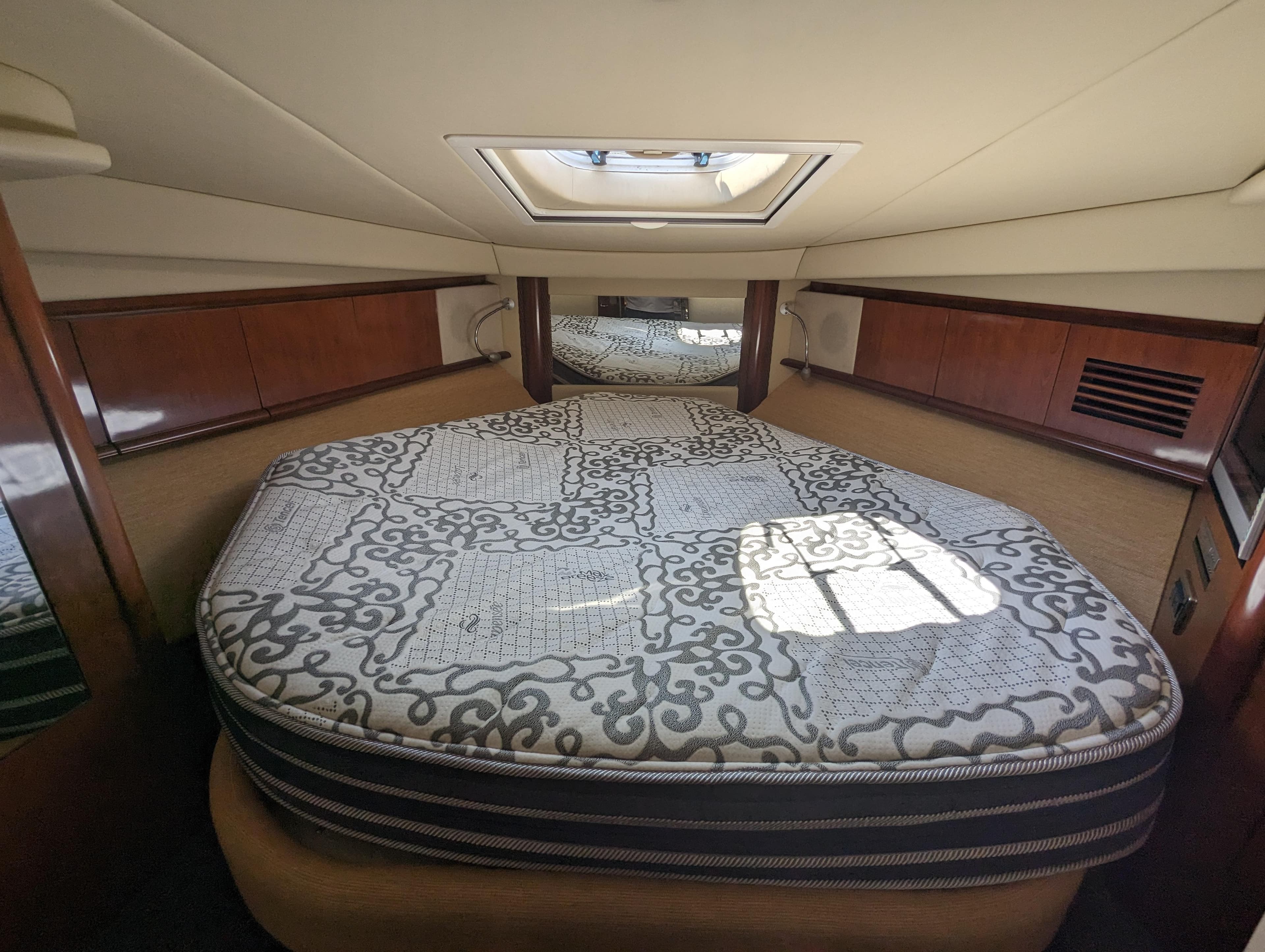 2005 Sea Ray 390 Sundancer cabin interior with bed and skylight.