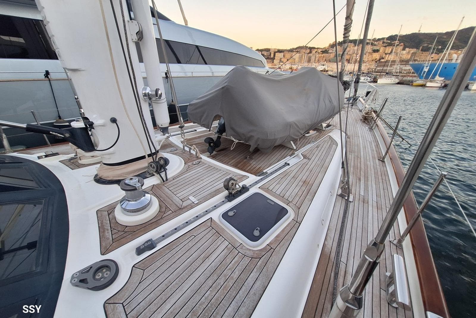 Deck view of a 2004 Oyster 825 yacht in a marina setting.