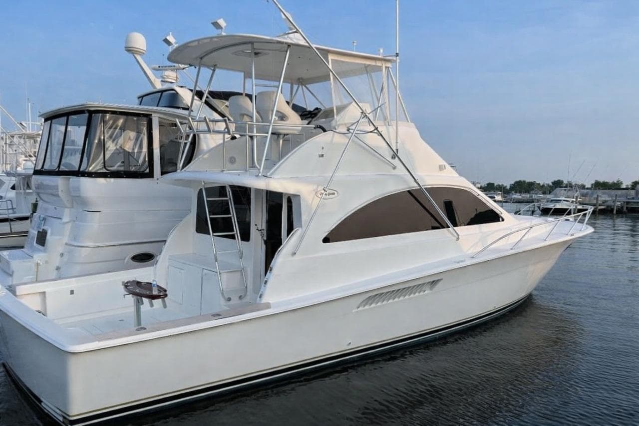 2005 Ocean Yachts 46 Super Sport docked at marina, side view.