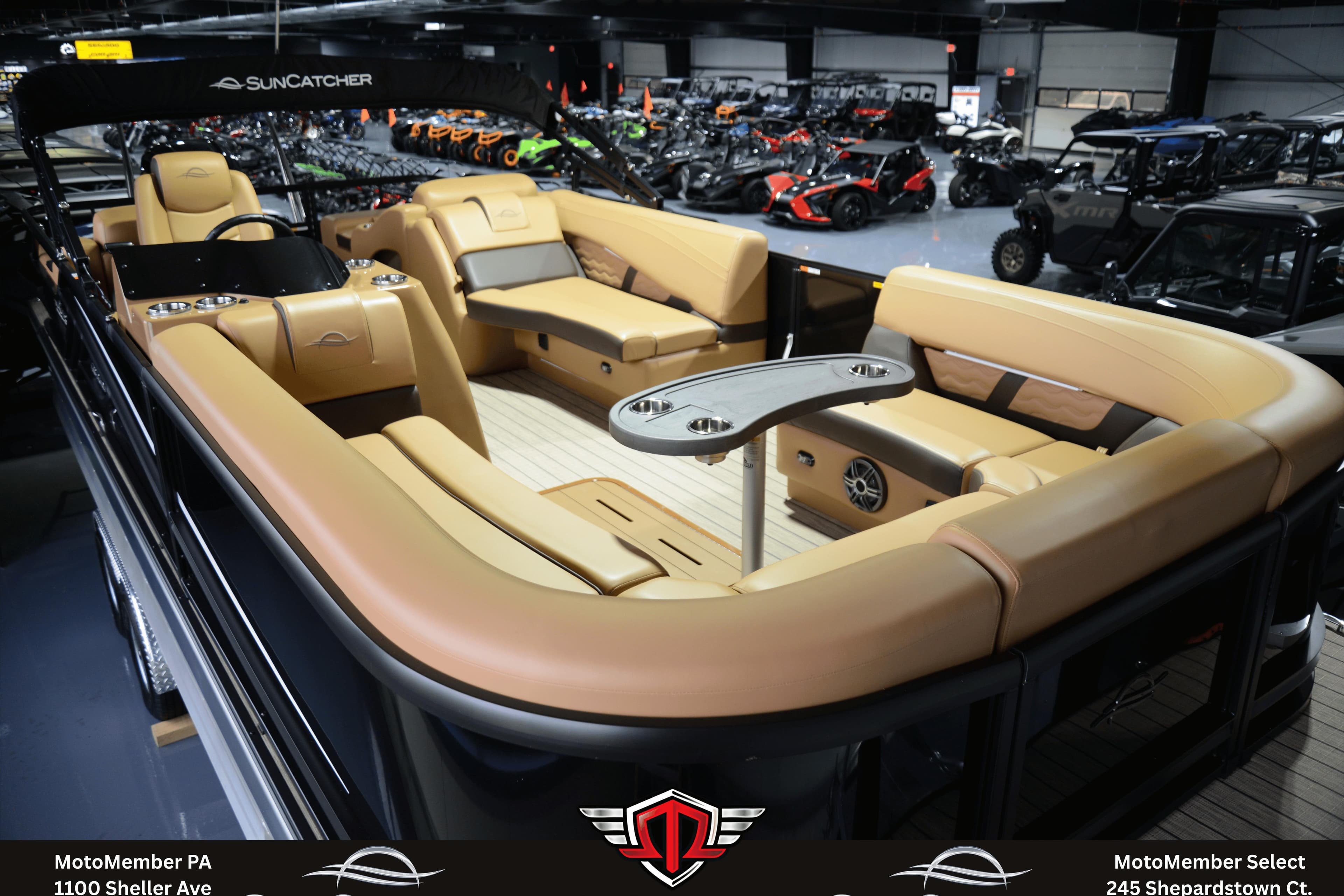 2025 SunCatcher Fusion 324SS pontoon boat with luxurious tan seating and modern design.