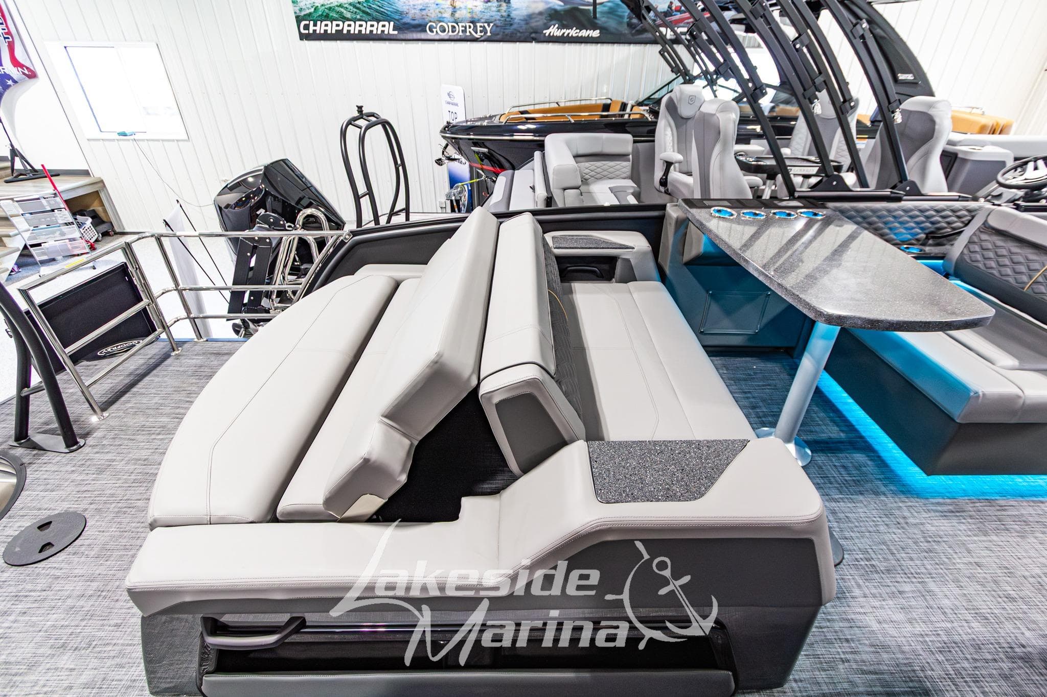Luxurious interior of 2026 Godfrey Sanpan 2700 MTF pontoon boat at Lakeside Marina.