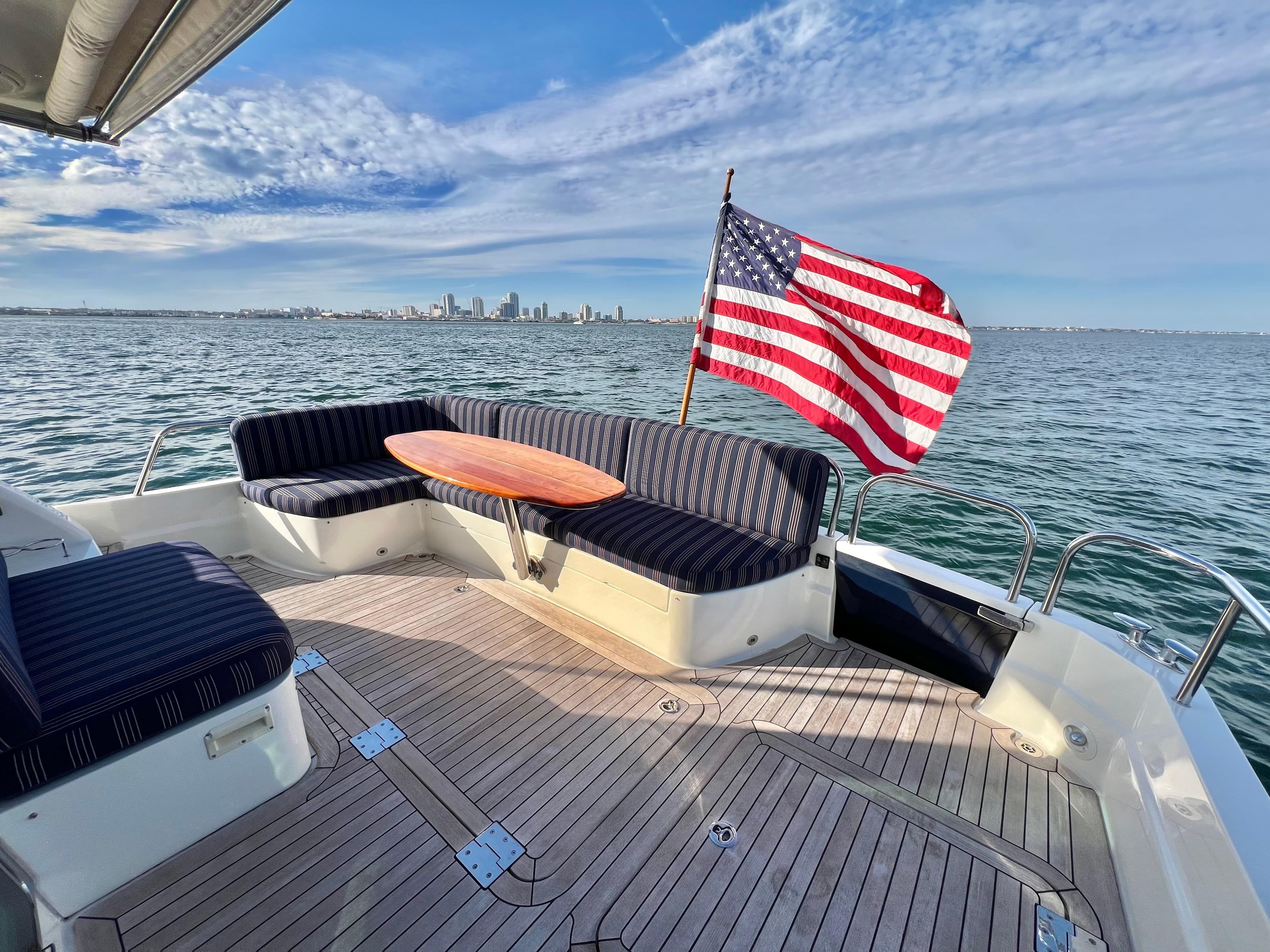 2017 Sabre 48 Salon Express yacht with US flag on the water.