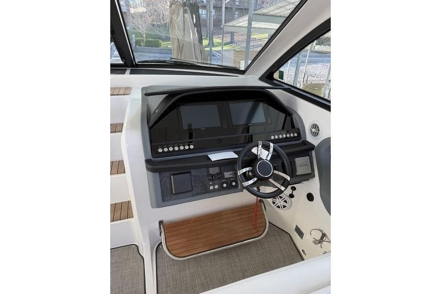 Helm of 2016 Cobalt A40 boat with modern controls and steering wheel.