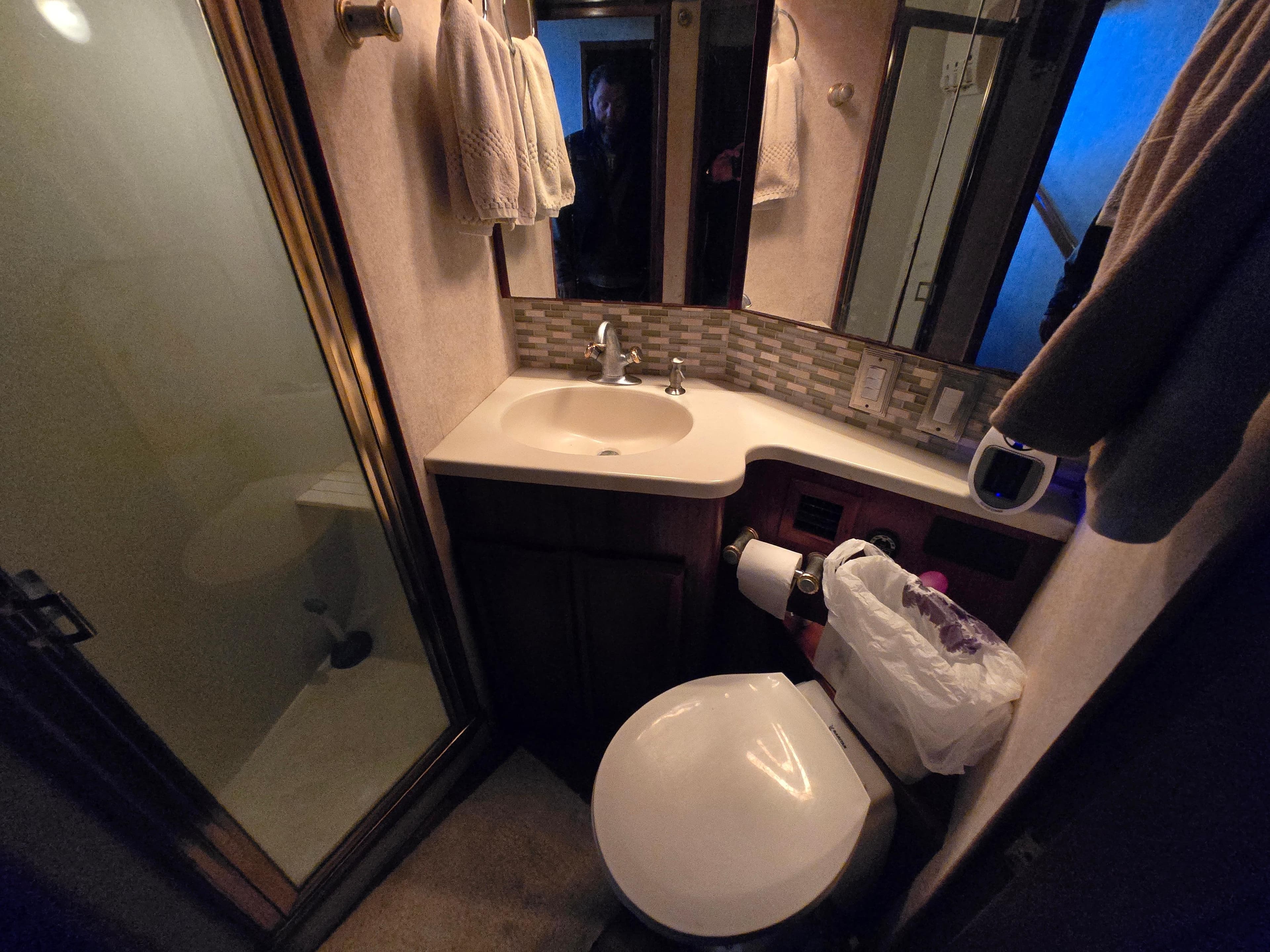 Bathroom interior of 1995 Egg Harbor 42 Convertible yacht with shower and sink.